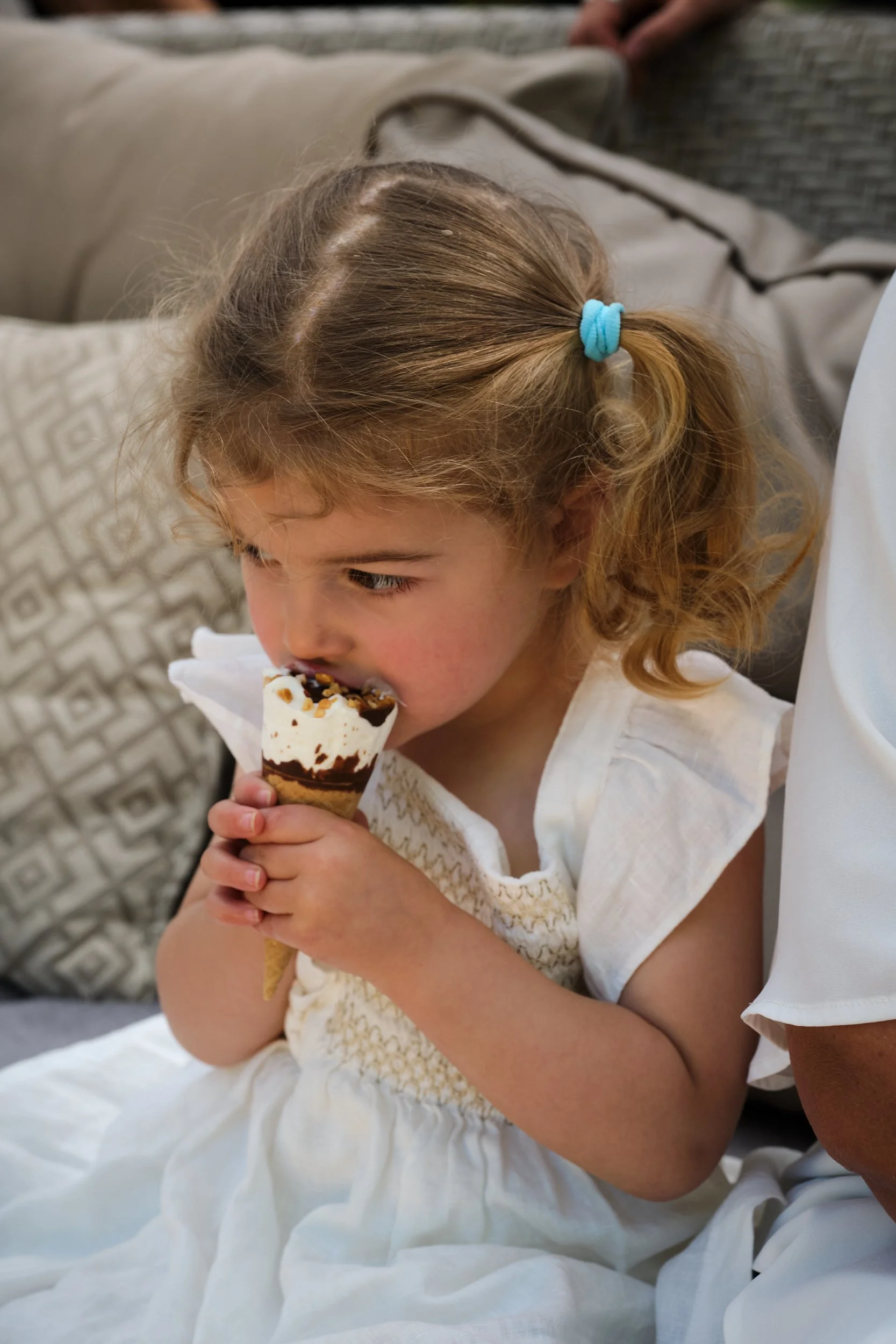 clark-at-home-farm-launceston-extended-family-little-girl-eating-ice-cream-cone.jpeg