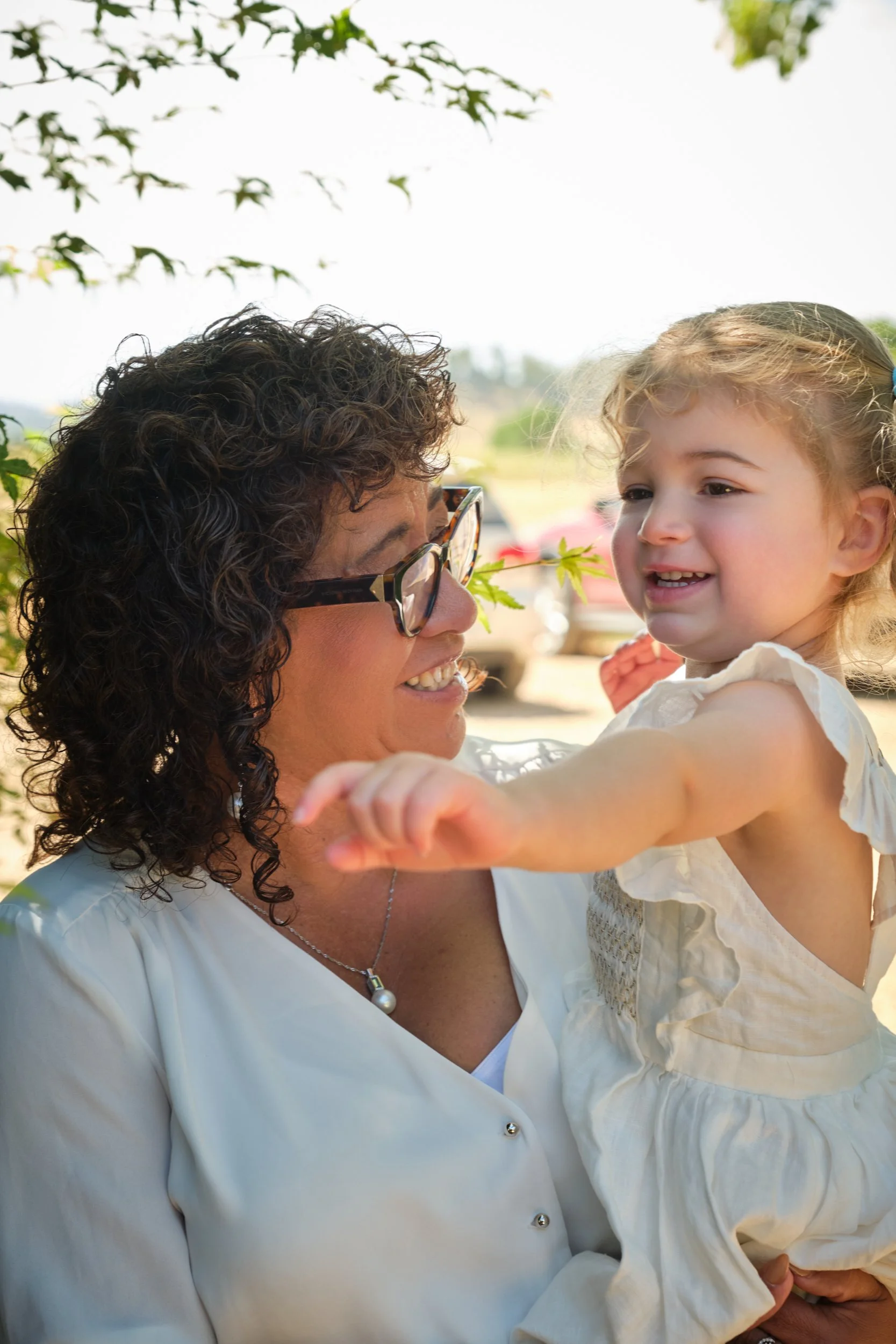 clark-launceston-extended-family-grandmother-holding-smiling-toddler-outdoors.jpeg