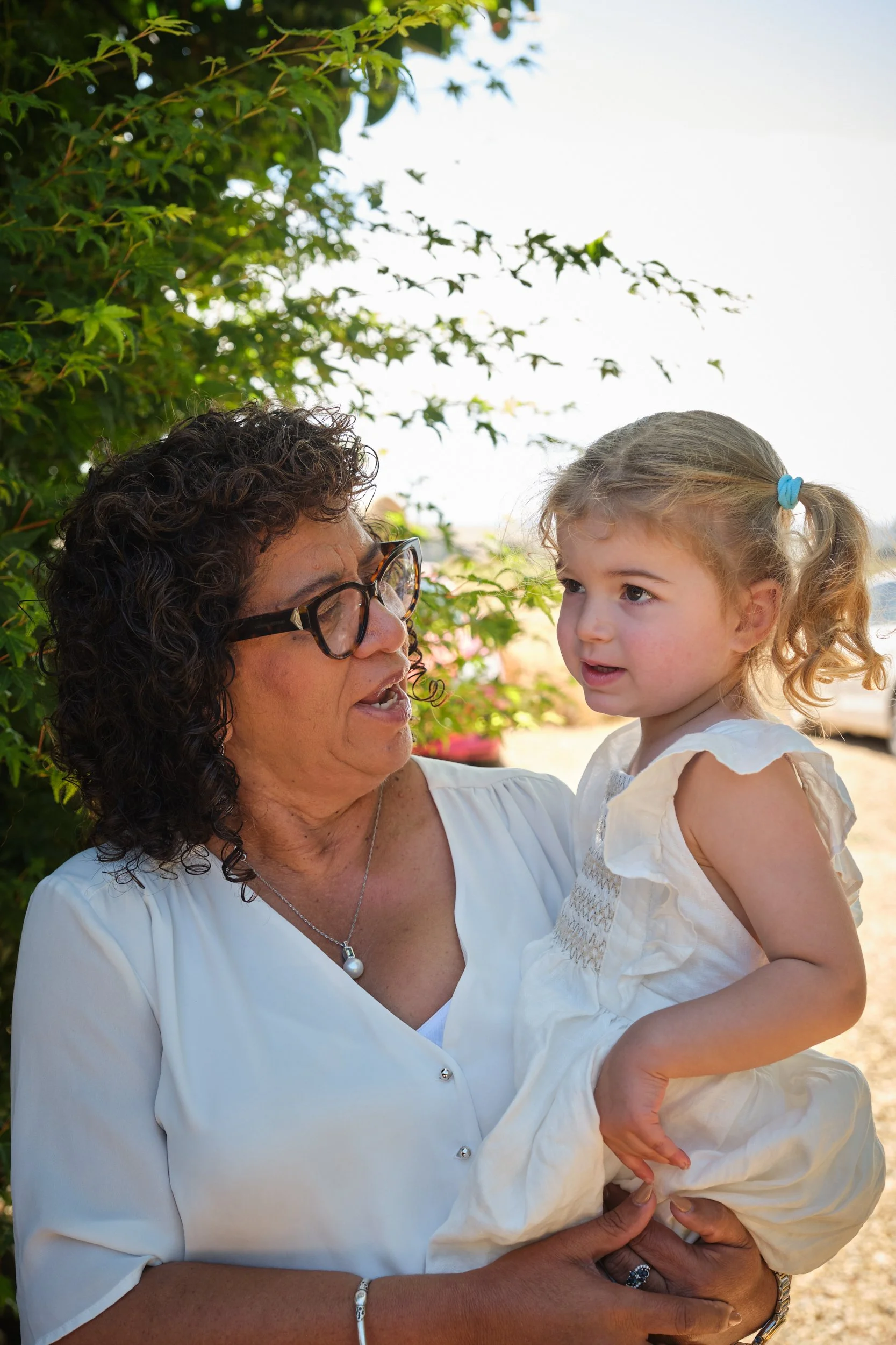clark-launceston-extended-family-grandmother-holding-toddler-outdoors.jpeg