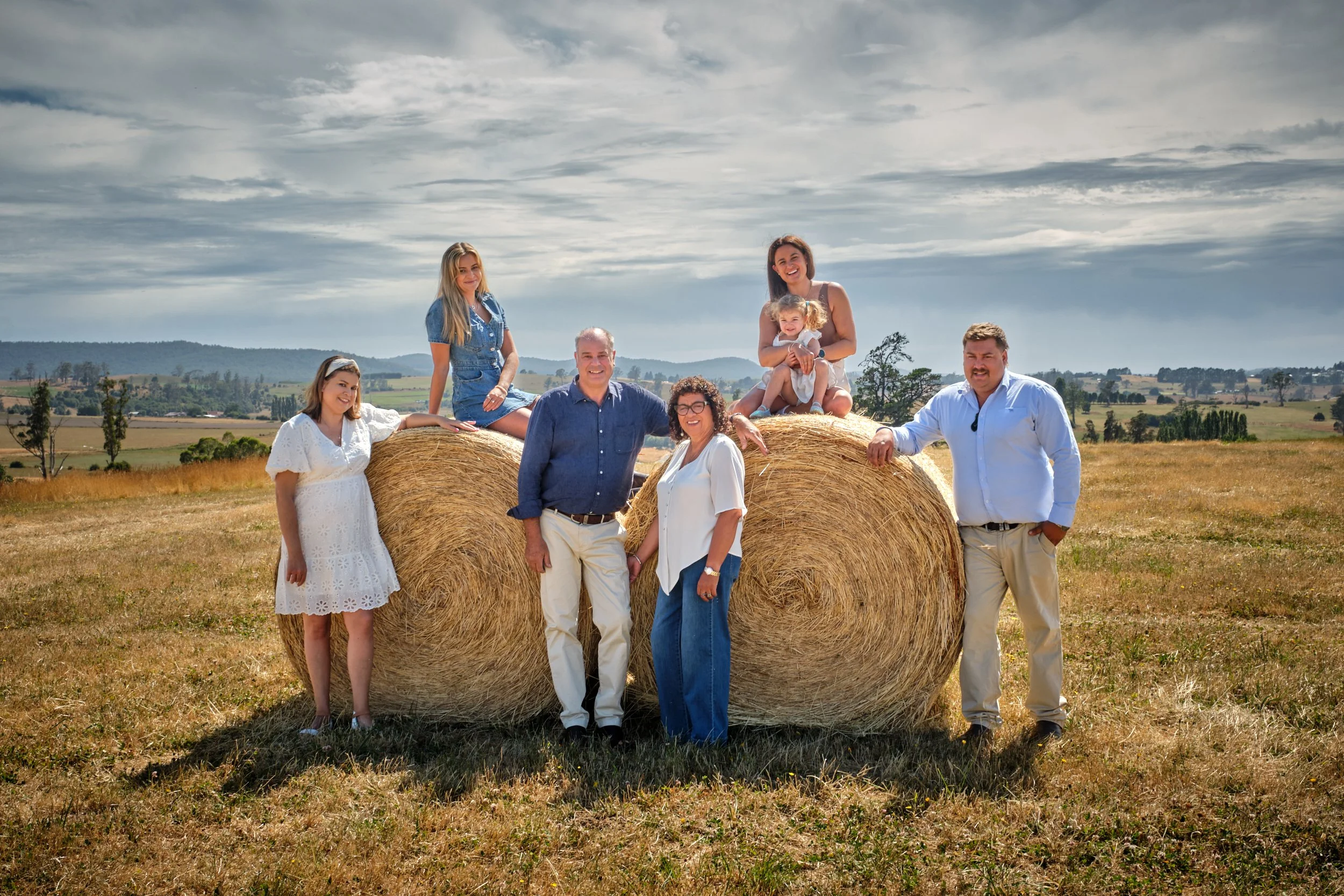 clark-launceston-extended-family-hay-bales-rural-farm-portrait.jpeg