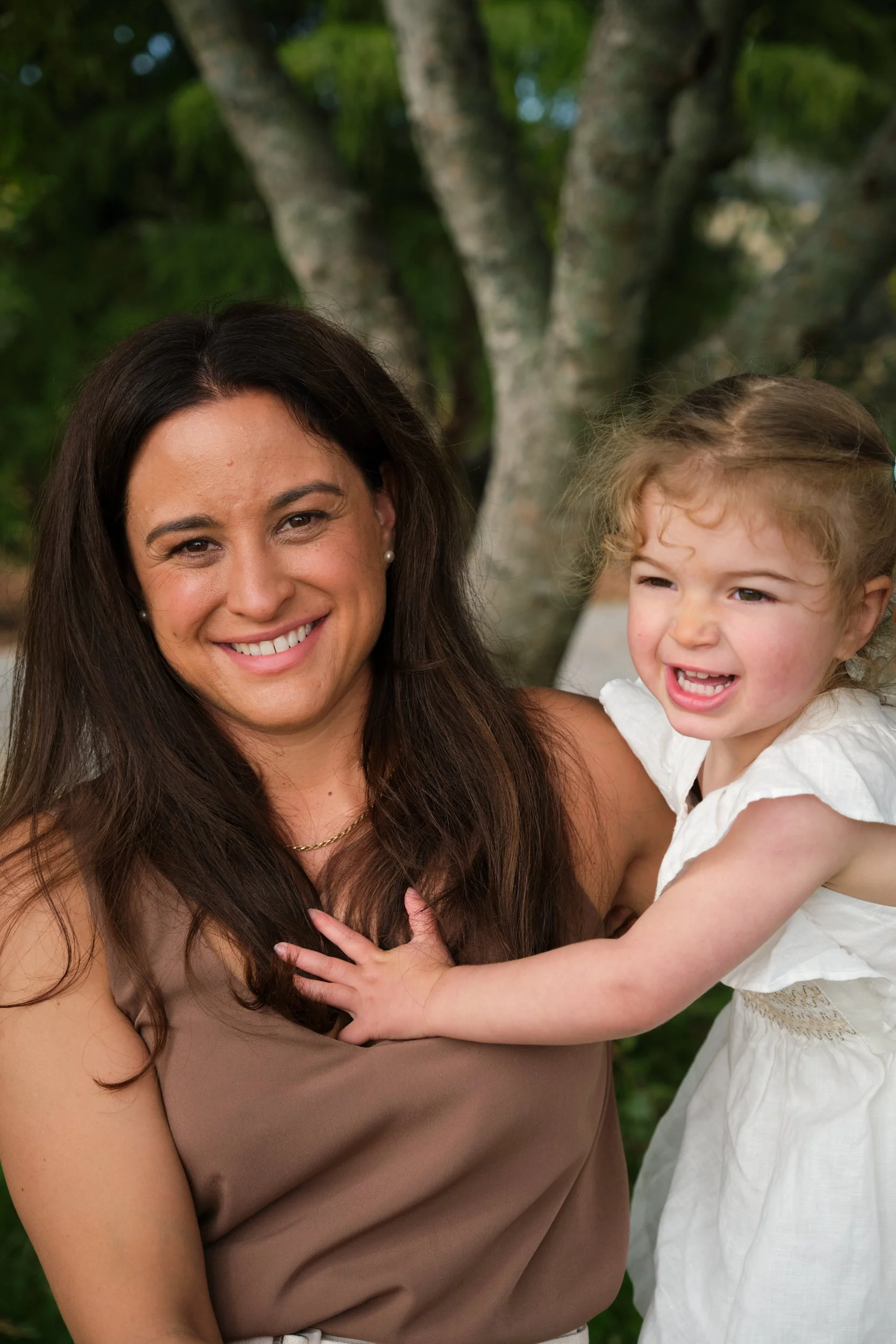 clark-launceston-extended-family-mother-and-daughter-smiling-outdoors.jpeg