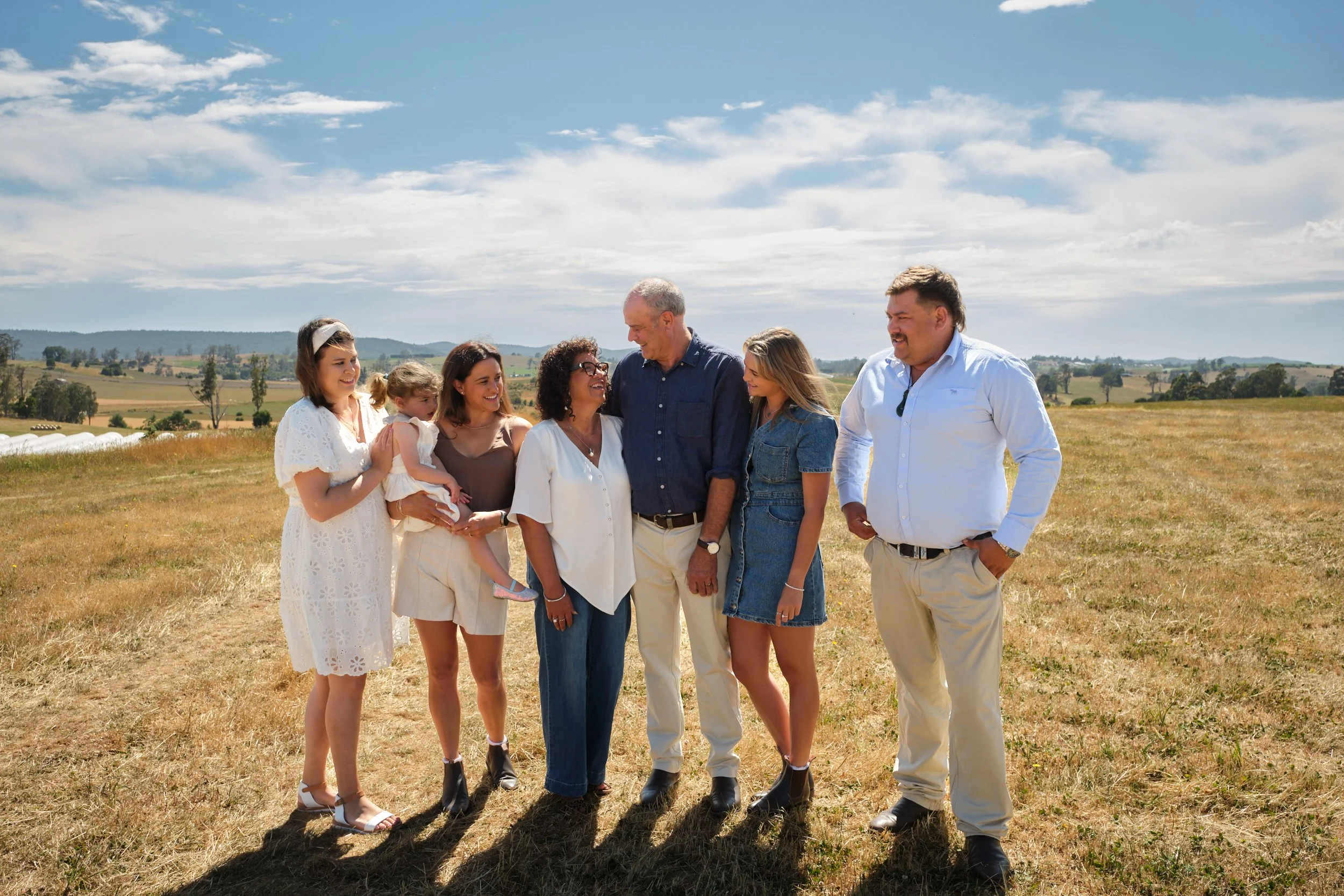 clark-launceston-extended-family-session-outdoor-farm-portrait-smiling-relaxed-together.jpeg