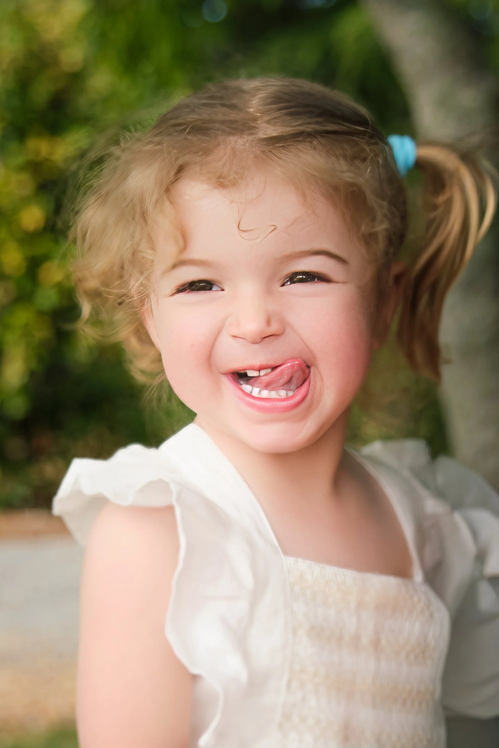 clark-launceston-extended-family-young-girl-smiling-playful-outdoor-portrait.jpeg