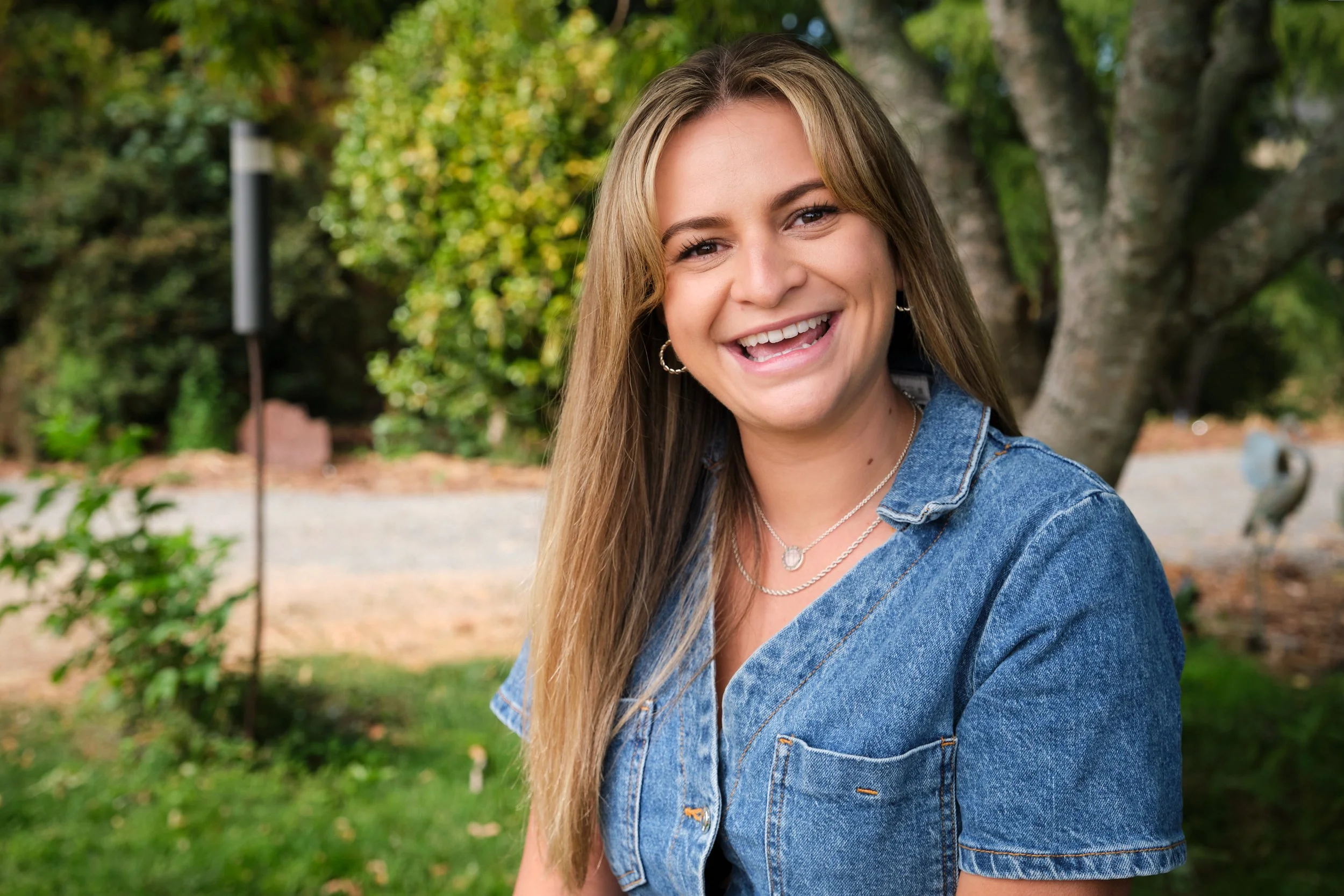 clark-launceston-extended-family-young-woman-smiling-outdoors-in-garden.jpeg
