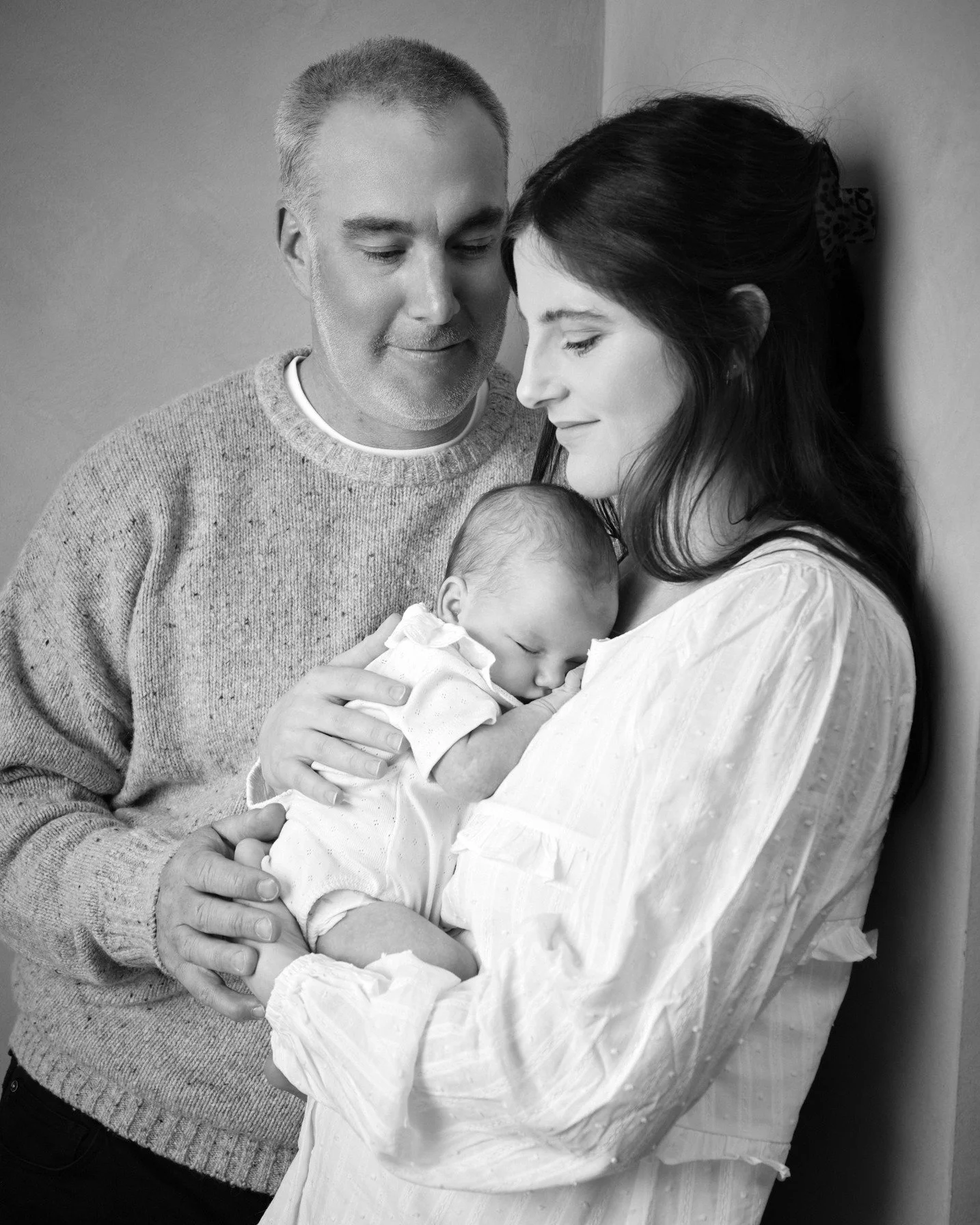 You won&rsquo;t see baskets, props, or elaborate setups in my newborn sessions. That style is incredibly skilled &mdash; it&rsquo;s just not what I do. I want your baby in your arms. I want to document how small they are against your chest, the way y