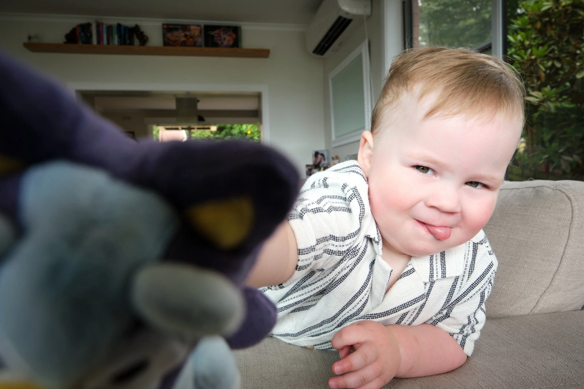 Natural expressions come from interaction, not asking kids to smile on cue. Rather than forcing fake smiles, I actively guide sessions with prompts, movement, and simple direction that helps kids relax and engage. The result is expressions that feel 