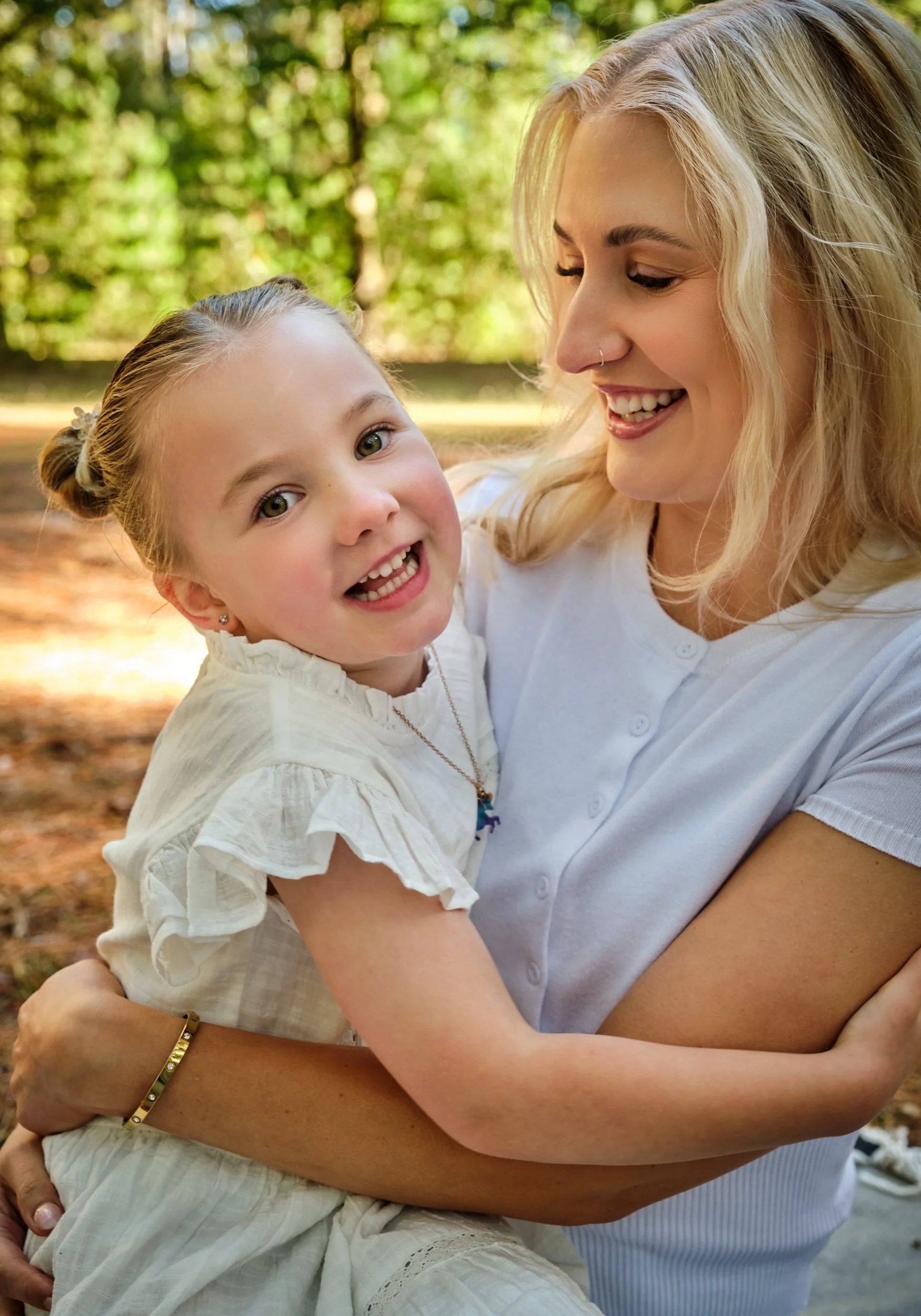 franks-hollybank-launceston-extended-family-portrait-mother-hugging-daughter-smiling-outdoors.jpeg