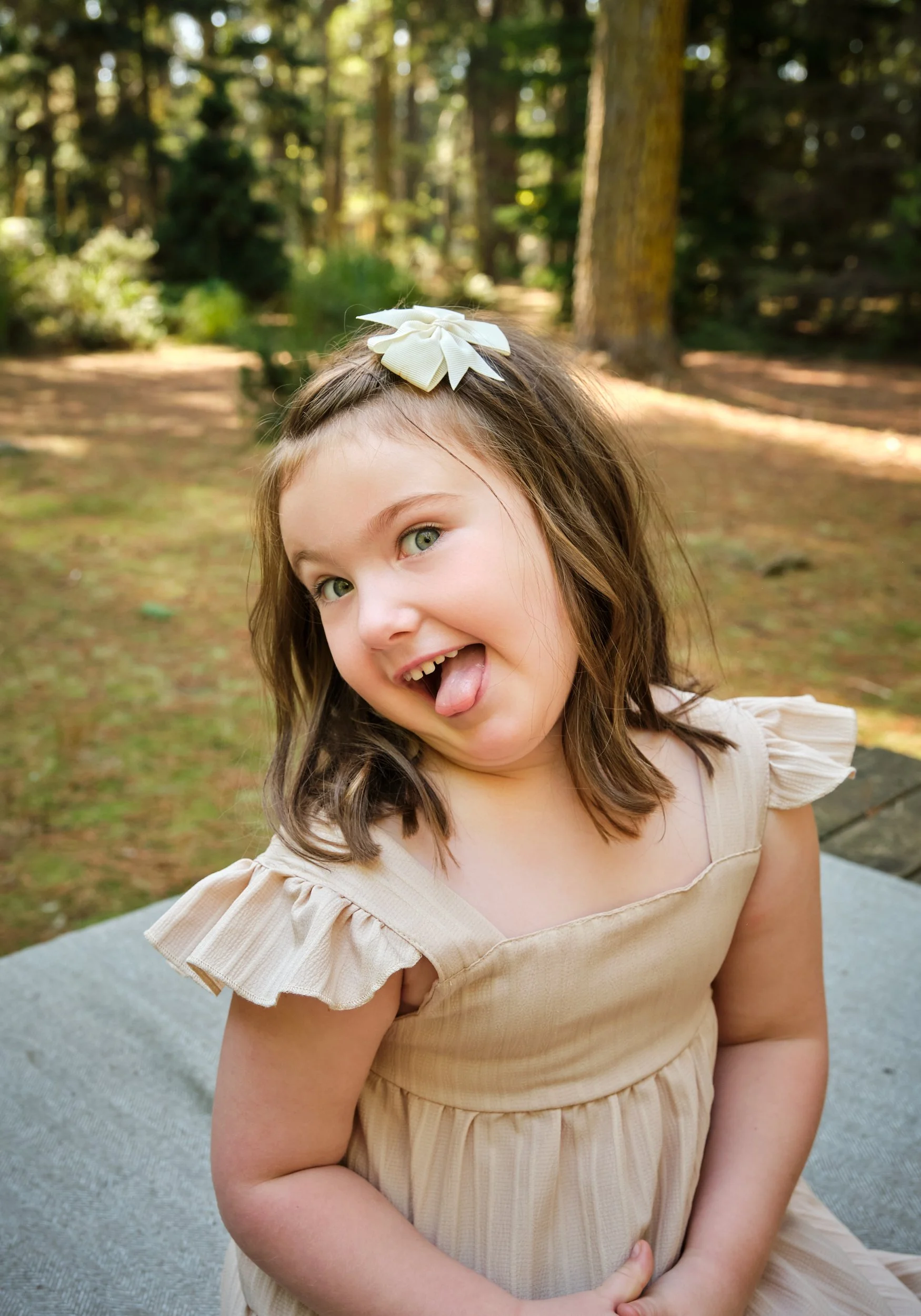 woods-hollybank-launceston-extended-family-photography-girl-smiling-playful-forest.jpeg