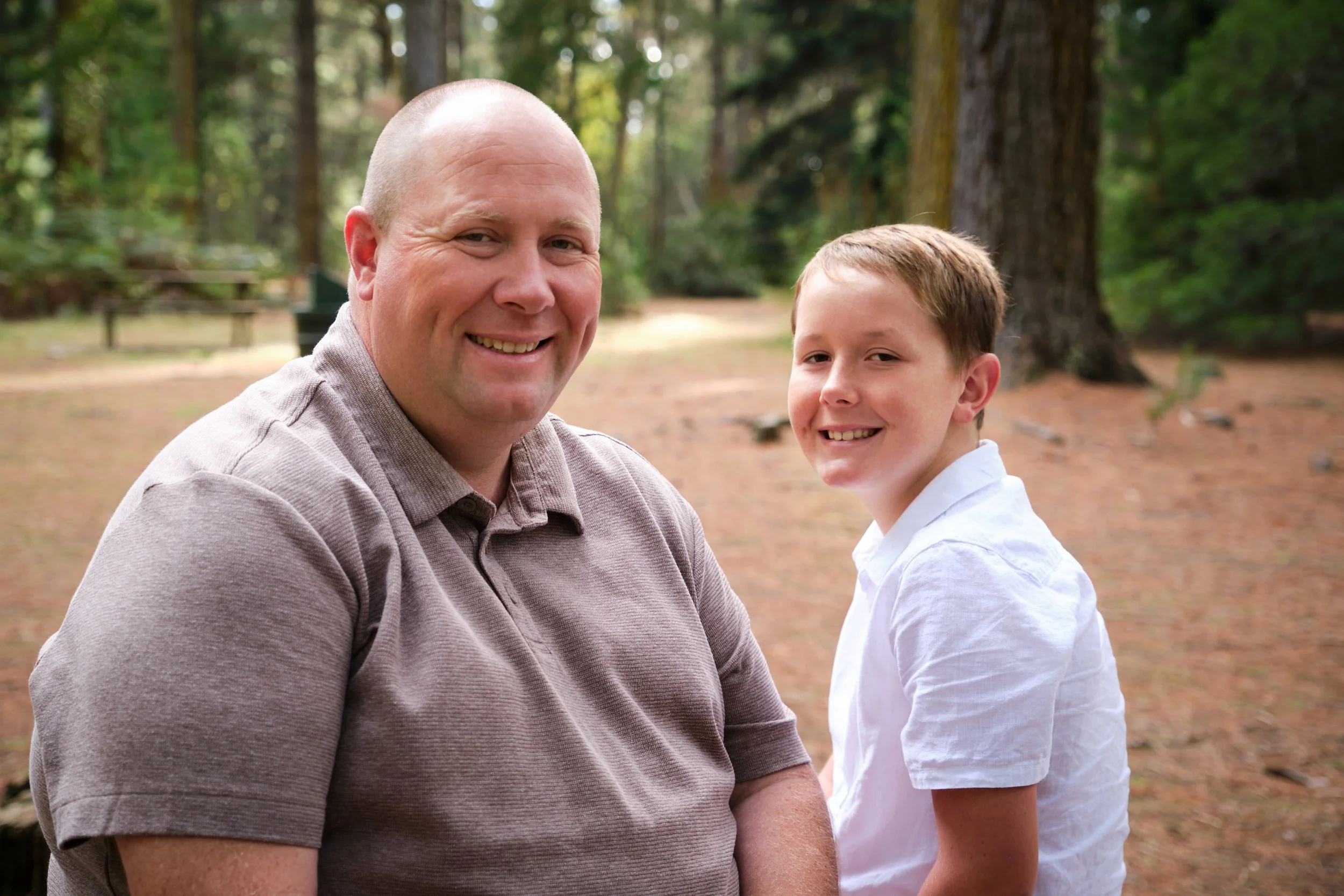north-hollybank-launceston-family-photography-dad-and-son-smiling-outdoor-portrait.jpeg