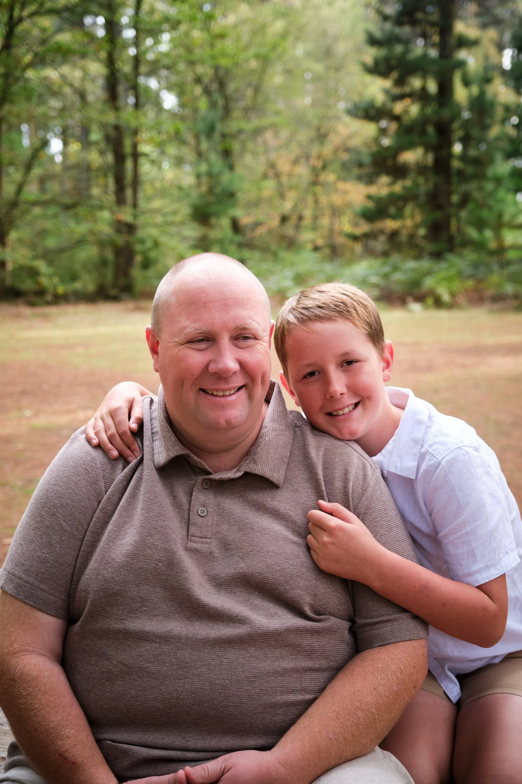 north-hollybank-launceston-family-photography-father-son-outdoor-portrait-smiling.jpeg