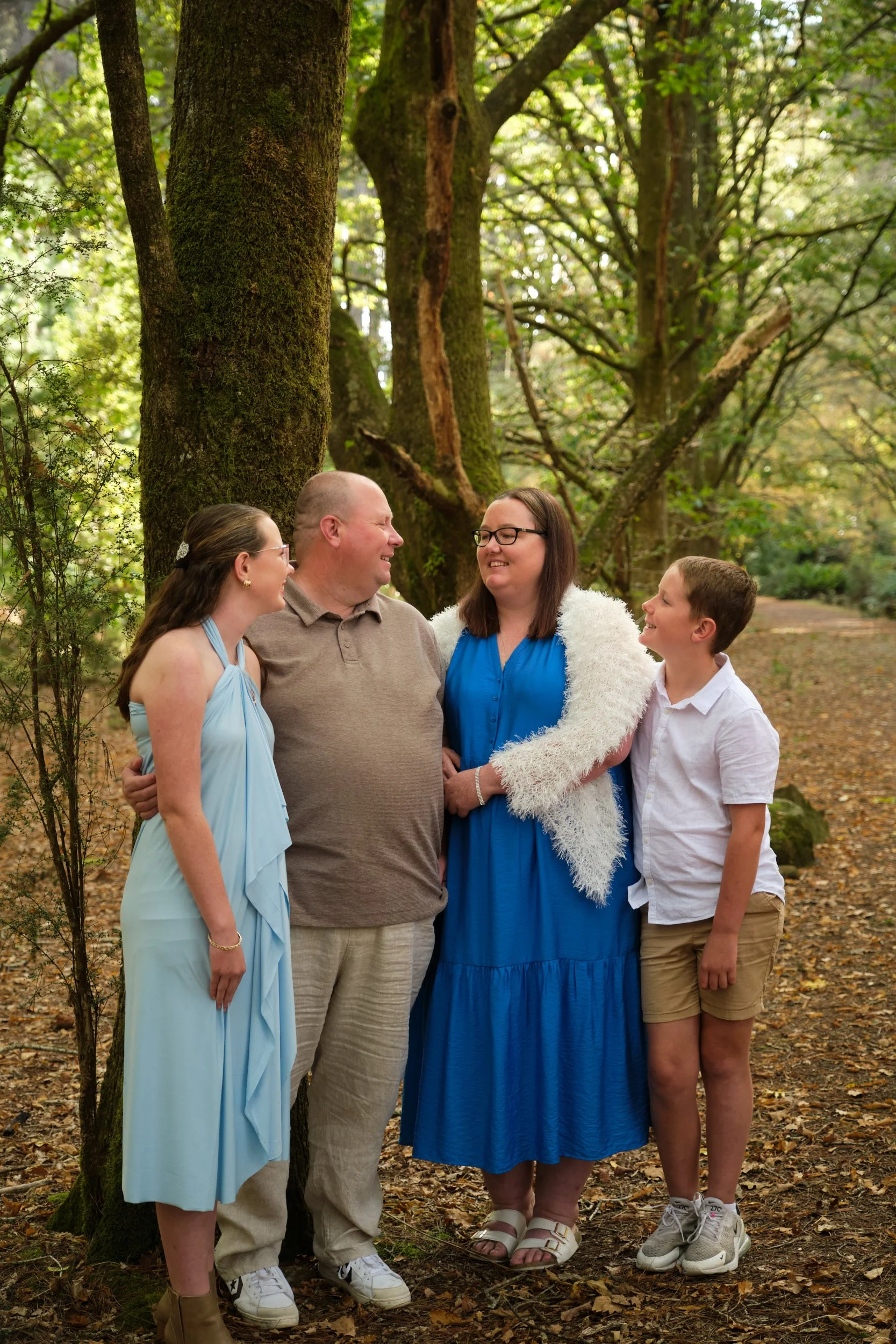 north-hollybank-launceston-family-photography-forest-portrait-smiling-family-of-four.jpeg