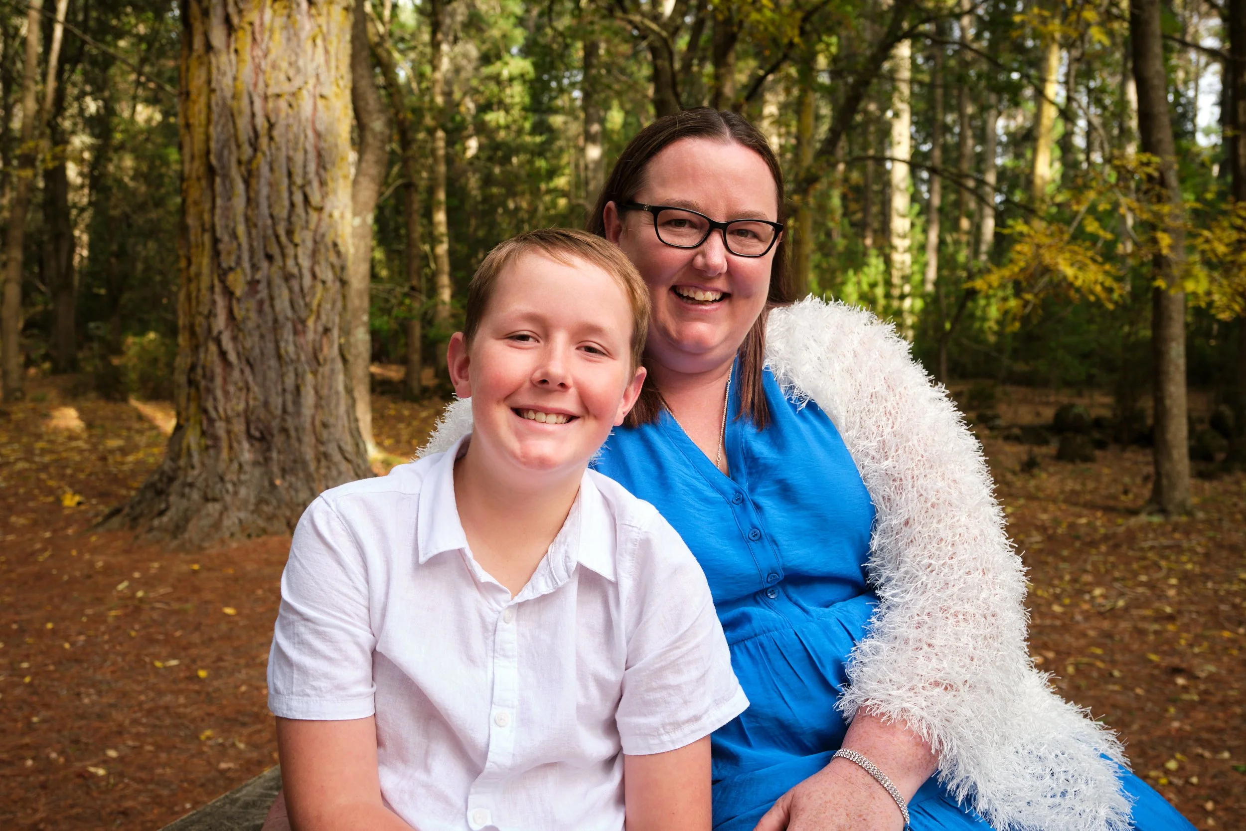 north-hollybank-launceston-family-photography-mother-and-son-smiling-in-forest.jpeg