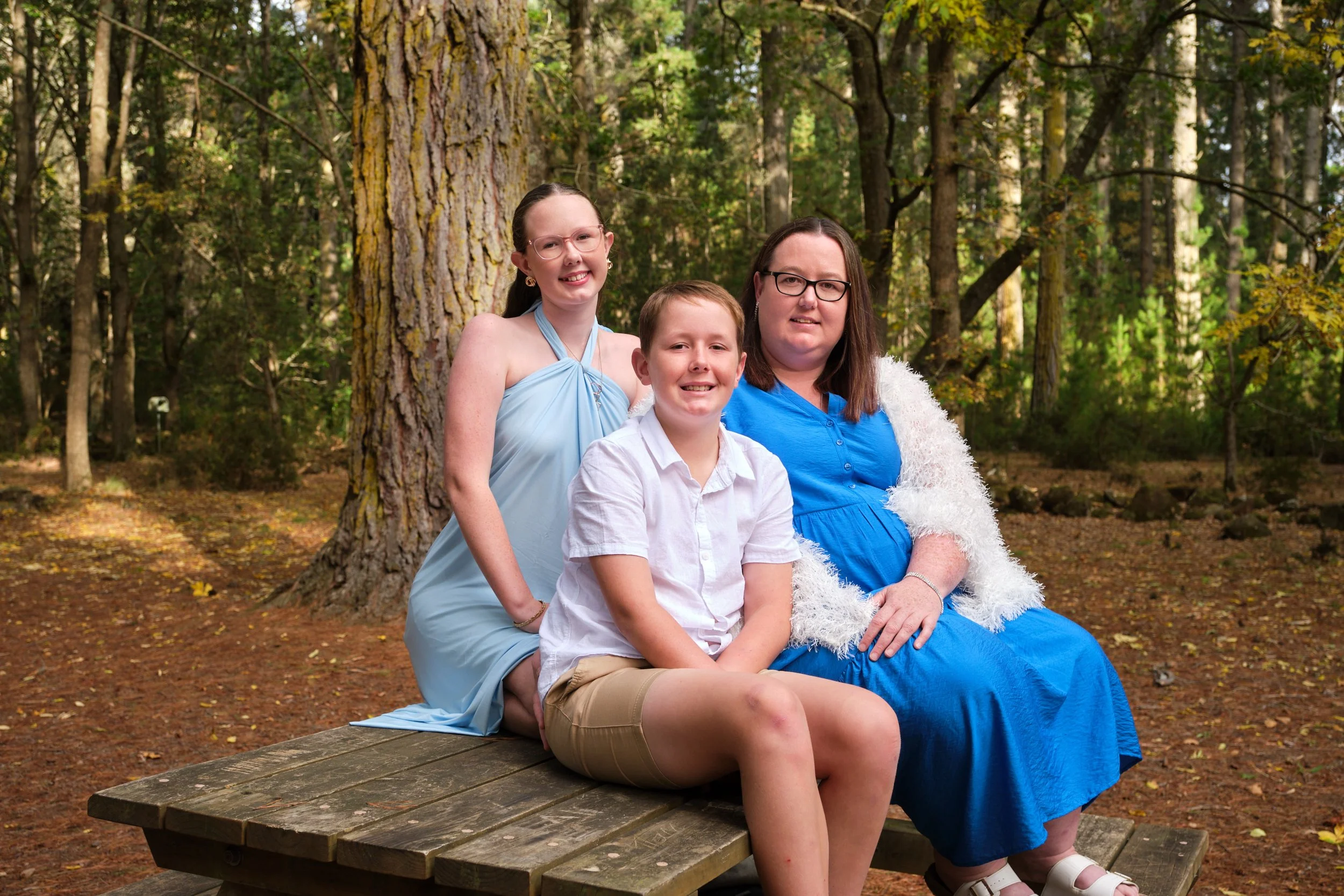 north-hollybank-launceston-family-photography-mother-children-forest-picnic-table-smiling.jpeg