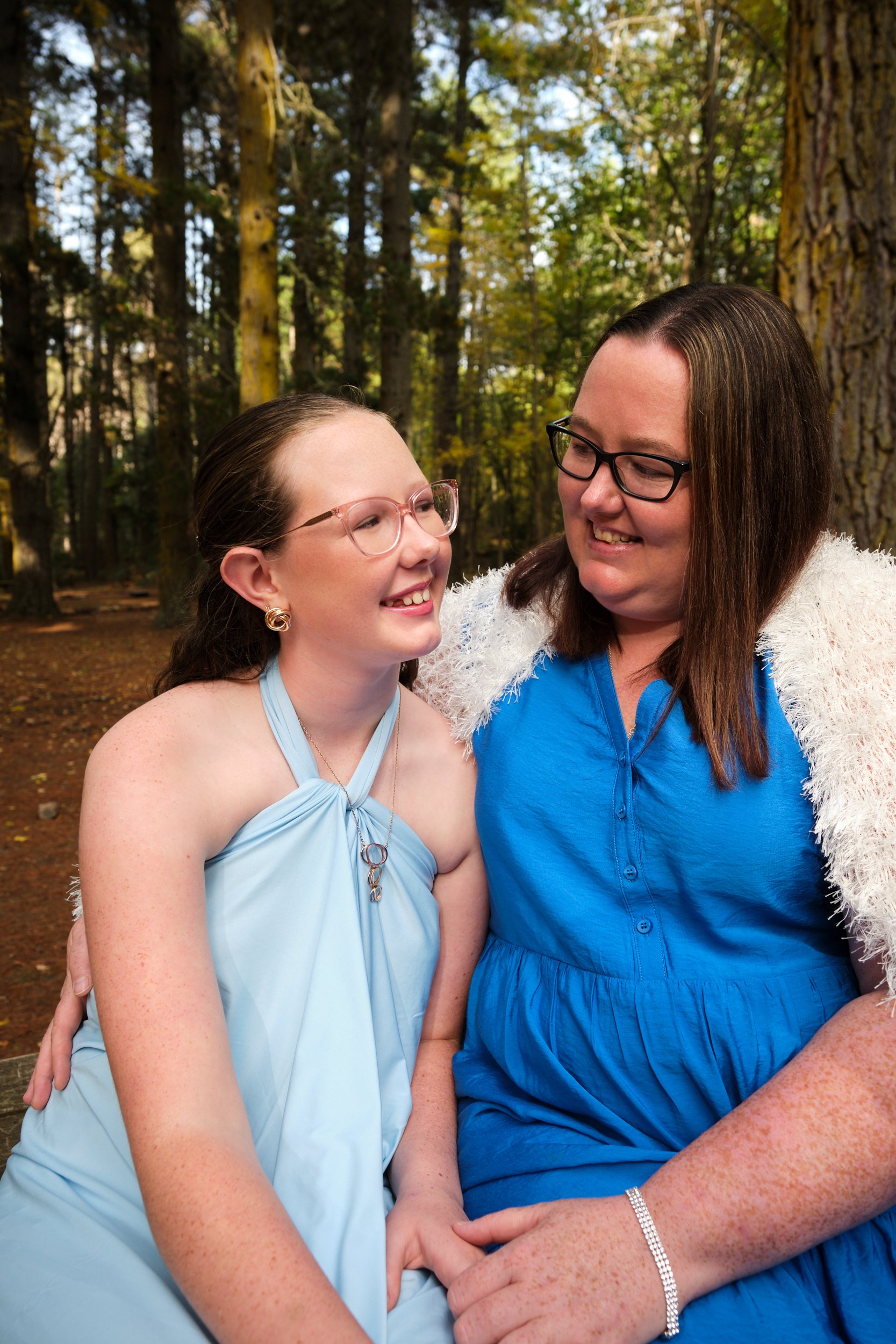 north-hollybank-launceston-family-photography-mother-daughter-smiling-forest-bench.jpeg