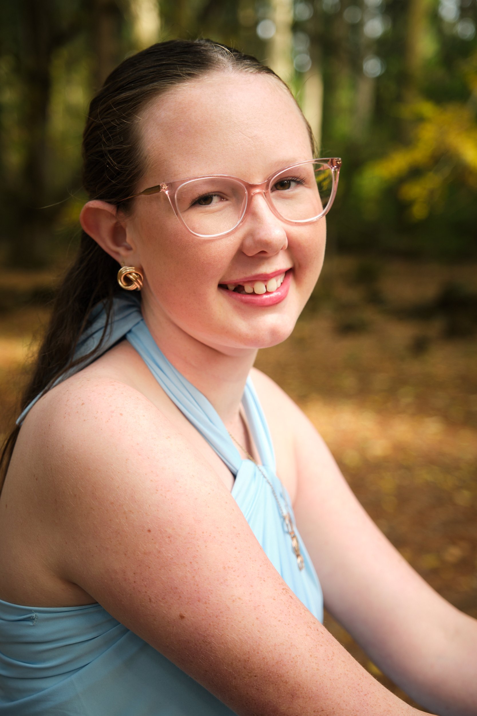 north-hollybank-launceston-family-photography-teen-girl-smiling-in-forest.jpeg