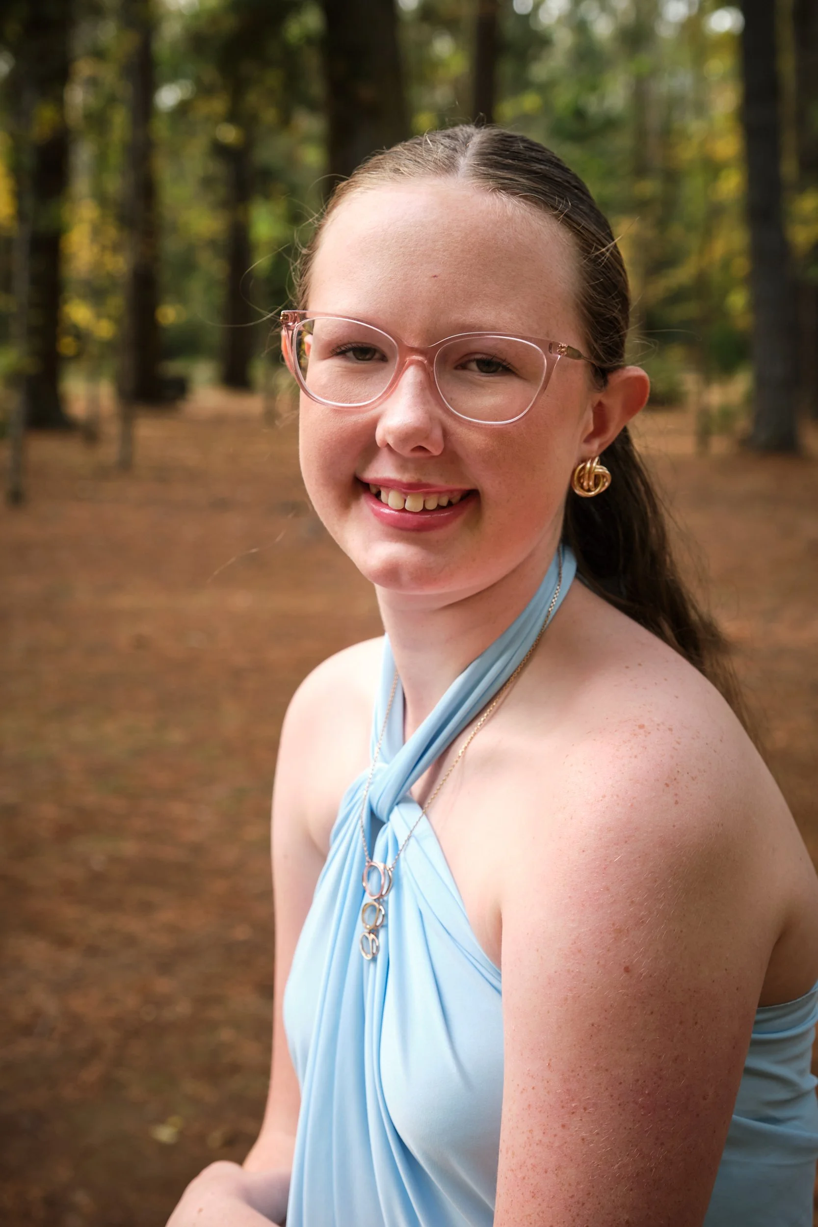 north-hollybank-launceston-family-photography-teen-girl-smiling-in-light-blue-dress.jpeg