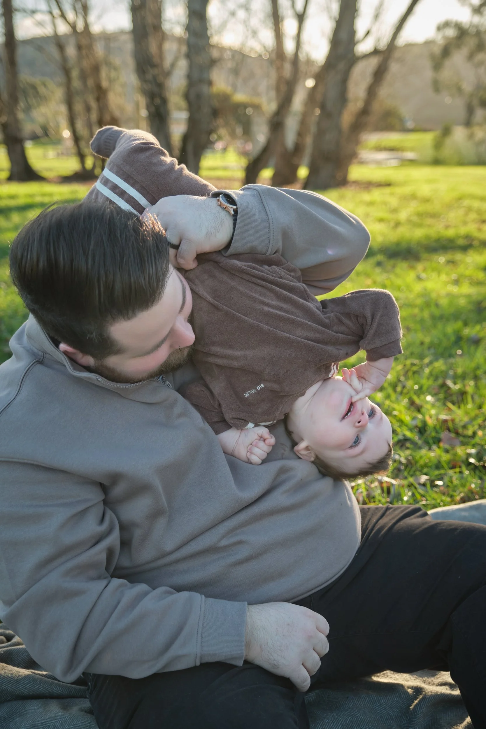 williams-hadspen-river-launceston-family-portrait-father-playing-upside-down-baby-2.jpeg