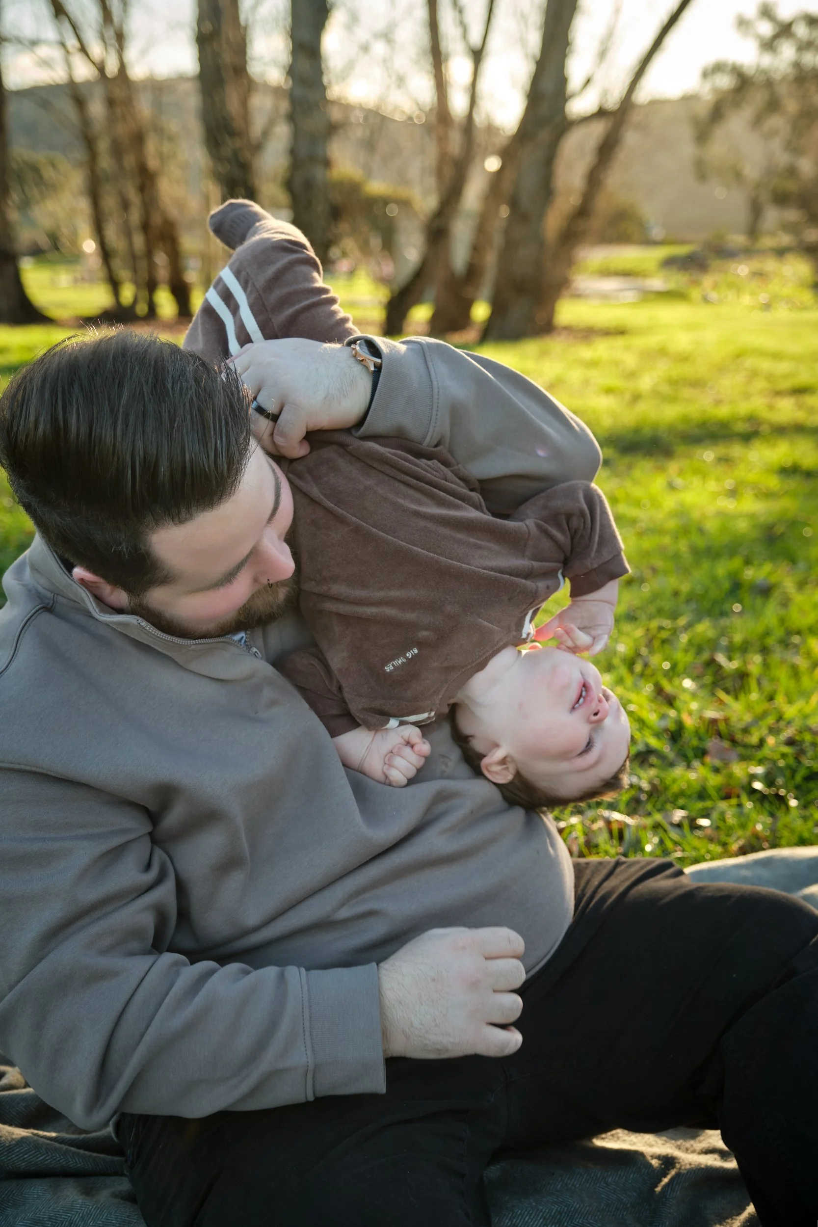 williams-hadspen-river-launceston-family-portrait-father-playing-upside-down-baby-3.jpeg