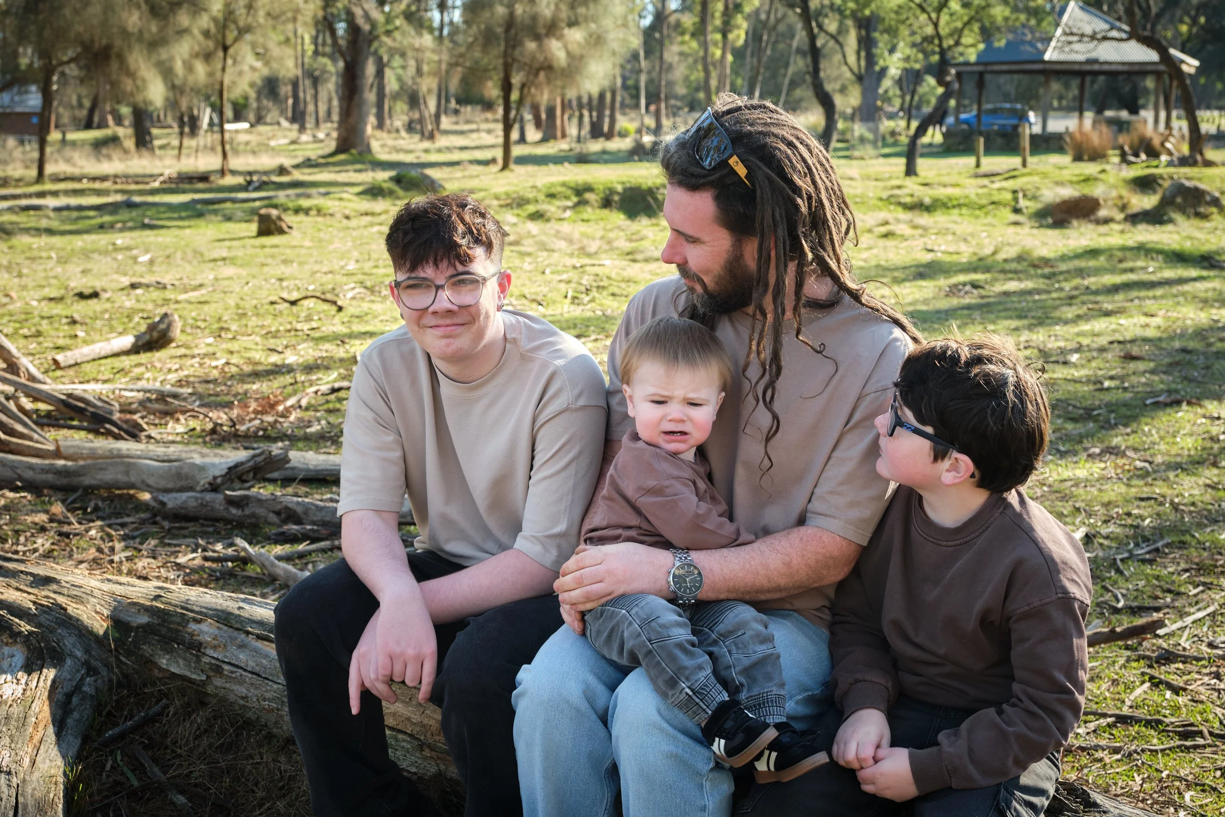 bennett-trevallyn-reserve-launceston-family-photography-dad-with-three-sons-outdoor-portrait.jpeg