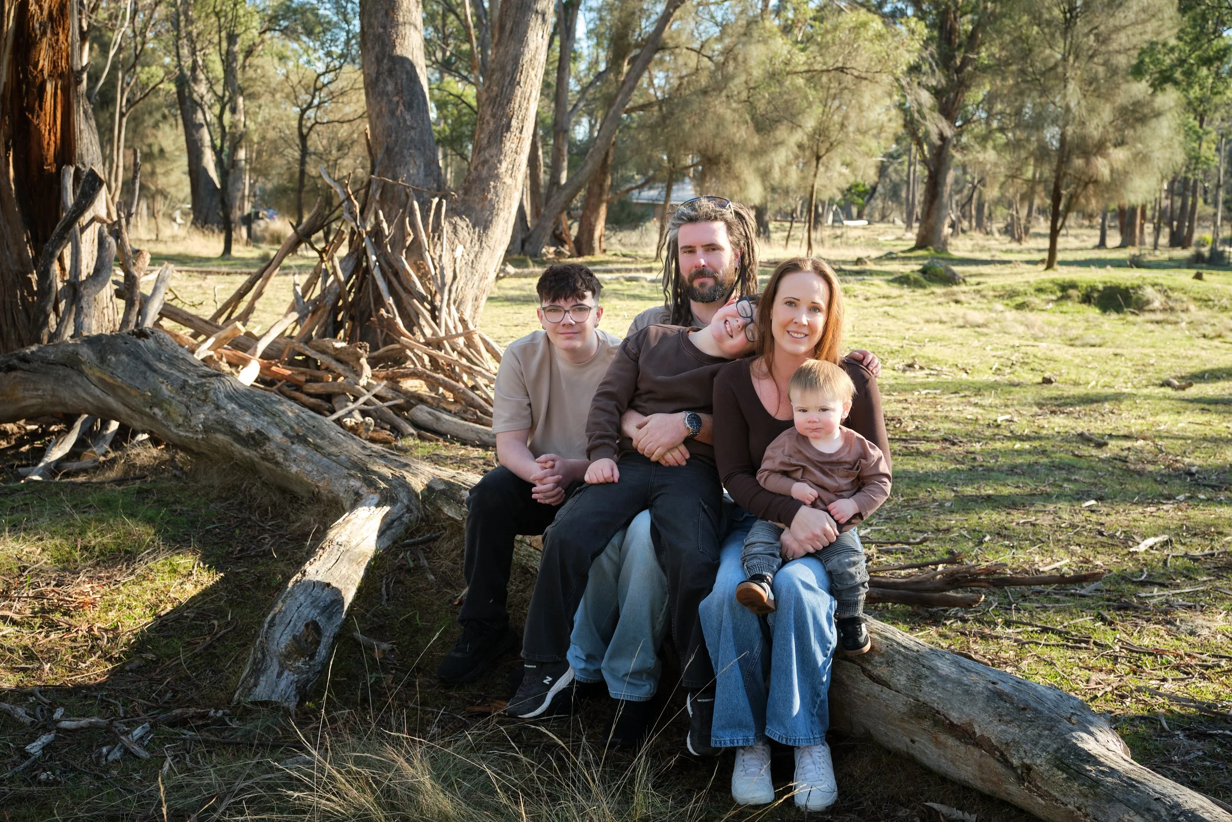 bennett-trevallyn-reserve-launceston-family-photography-outdoor-forest-log-family-portrait.jpeg