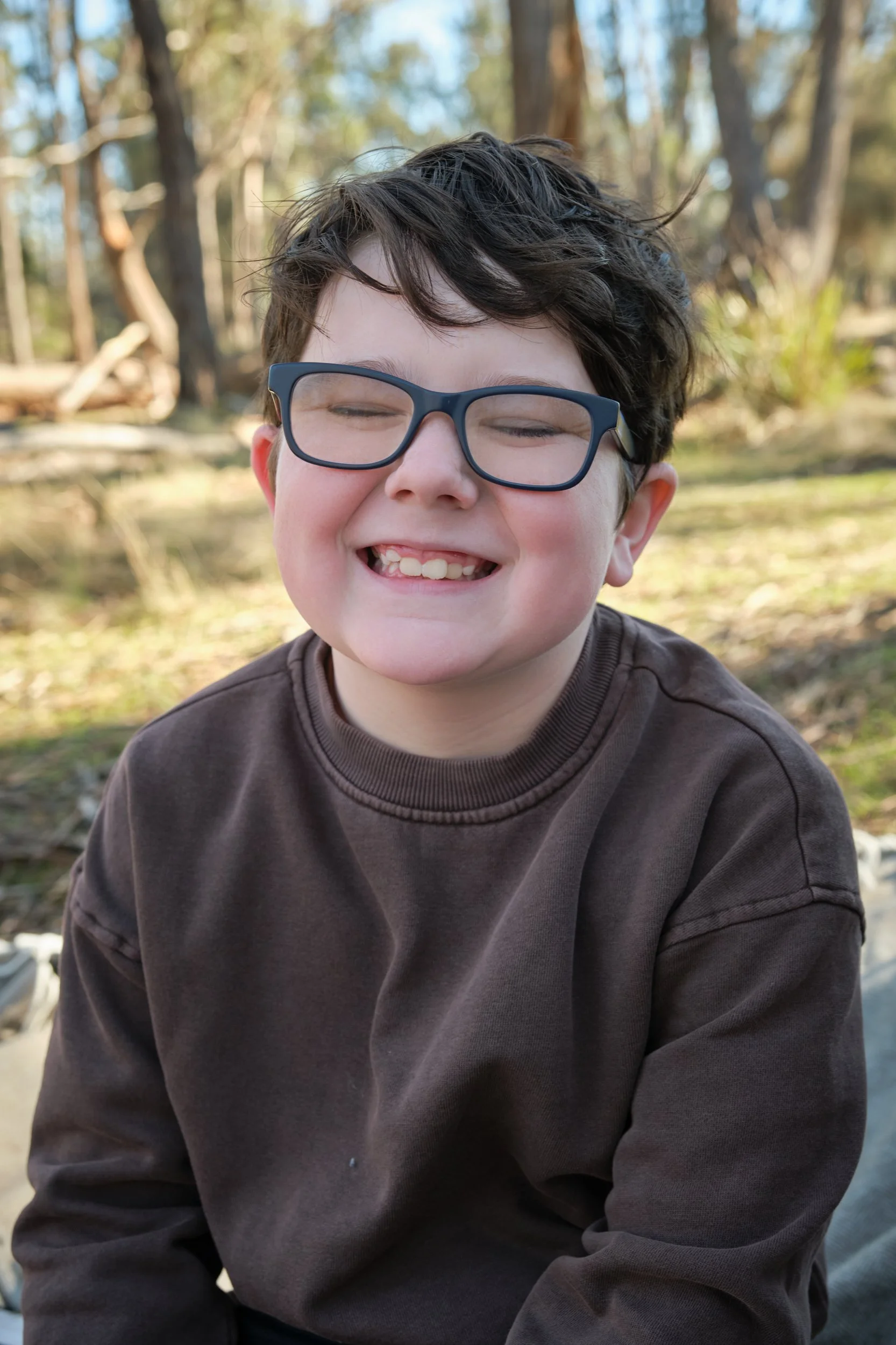 bennett-trevallyn-reserve-launceston-family-photography-smiling-boy-outdoors-glasses.jpeg