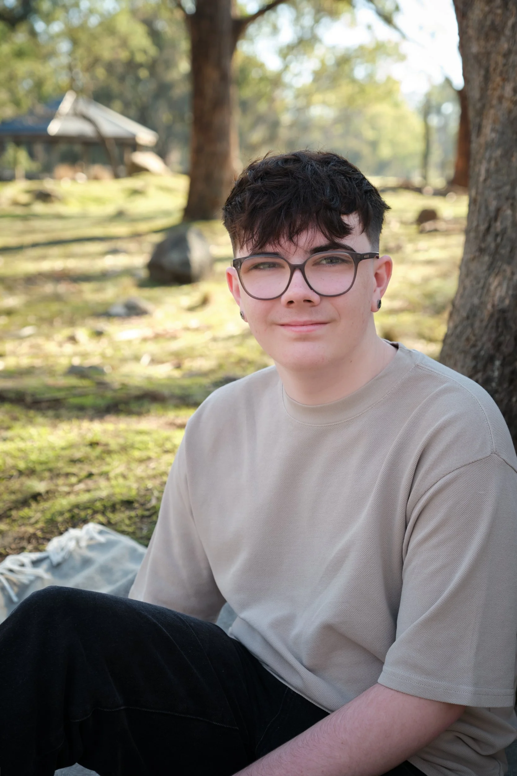 bennett-trevallyn-reserve-launceston-family-photography-teen-sitting-on-blanket-outdoors.jpeg