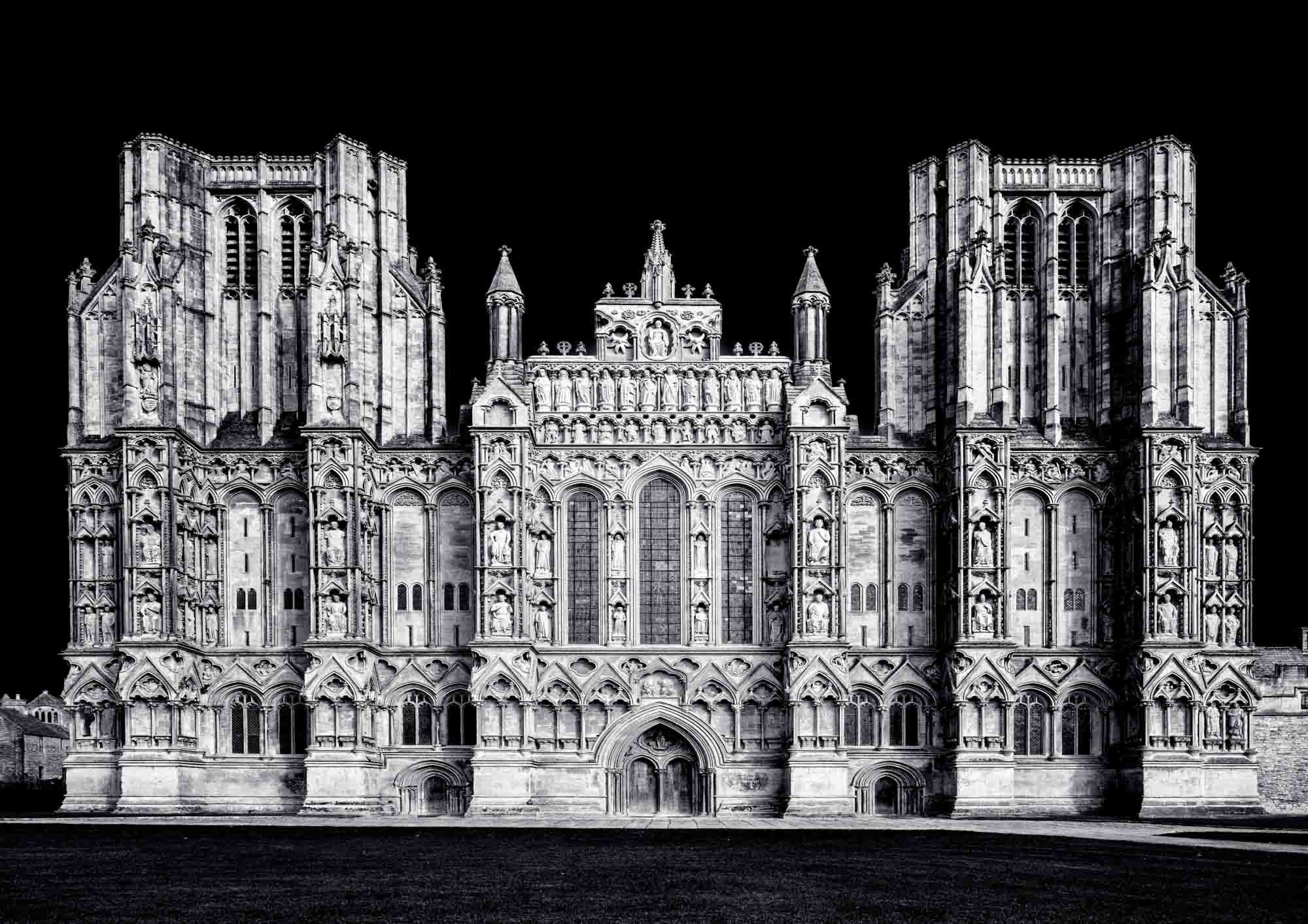 Wells Cathedral facade in monochrome showing intricate Gothic detail