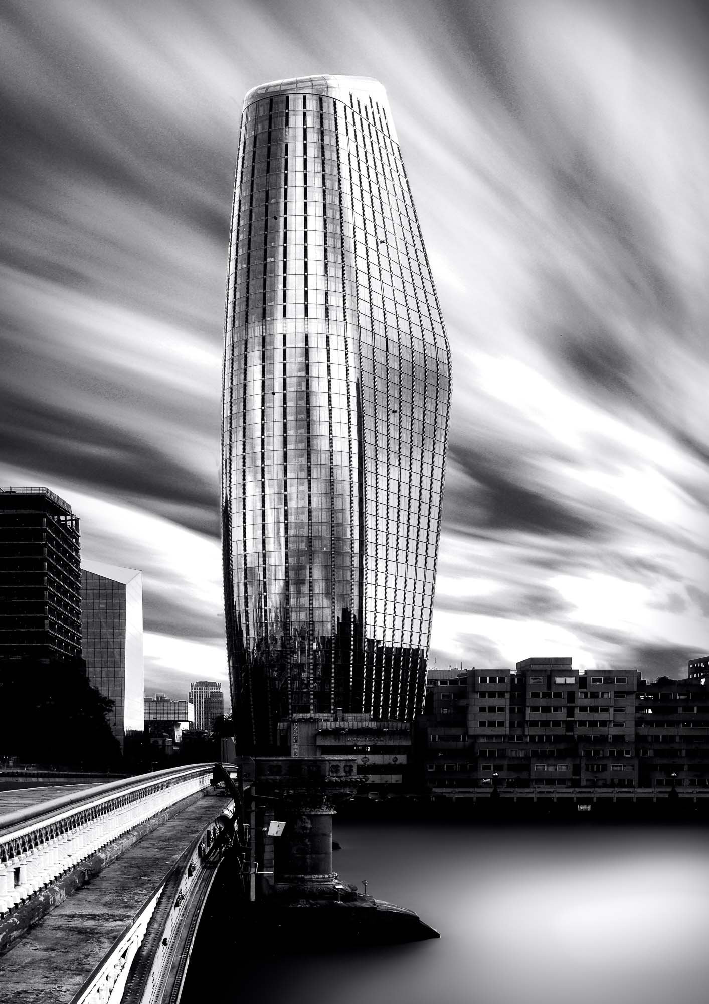 Boomerang Tower captured in motion—architectural silhouette slicing the sky.