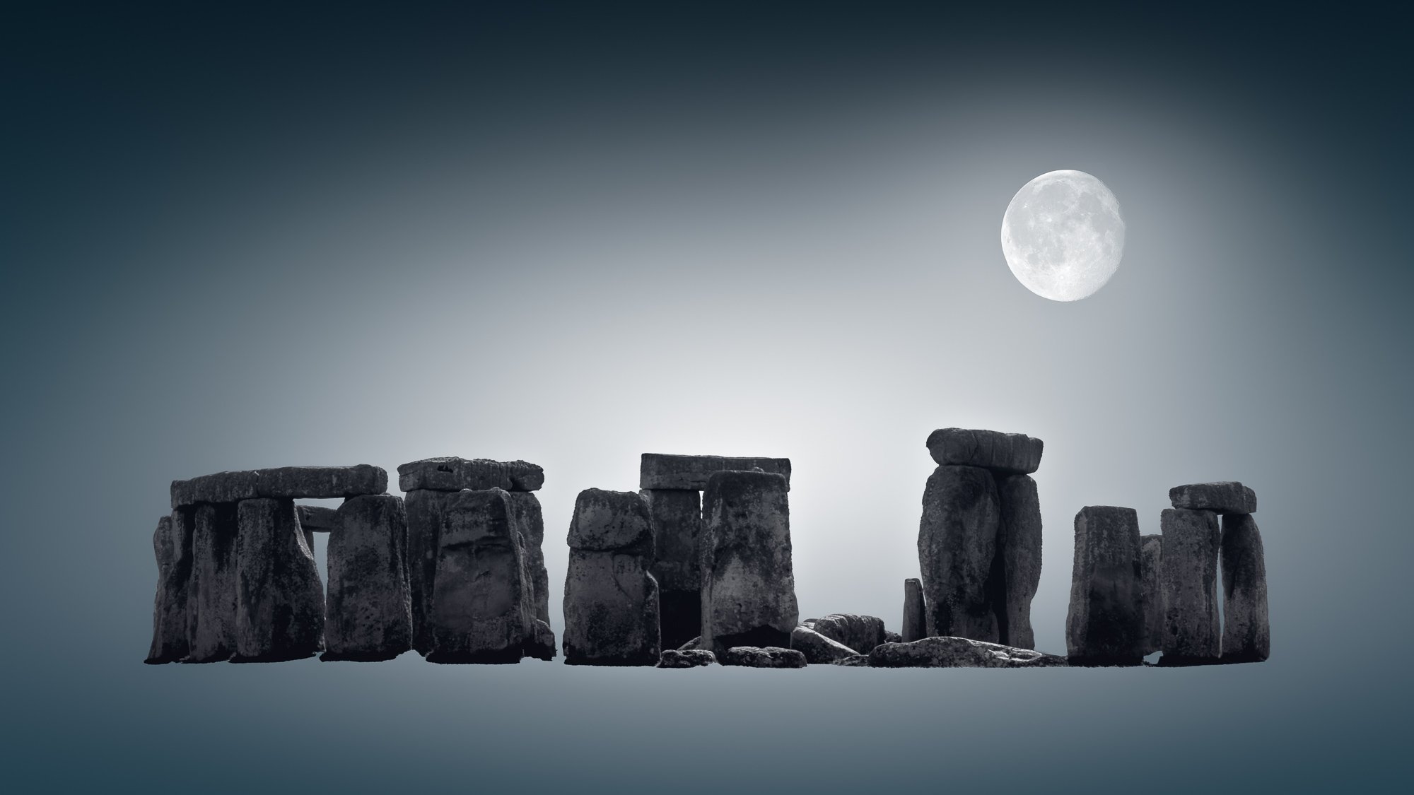 Full moon over Stonehenge—timeless monument framed in deep minimalist tones.