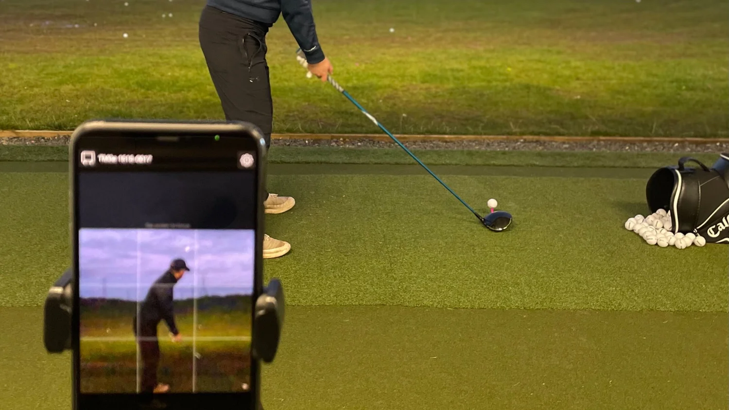 Filming a golf swing during Swanston golf lessons