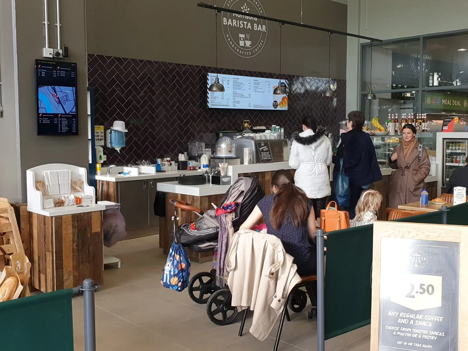 A PassageWay multi-modal digital sign on display at a cafe