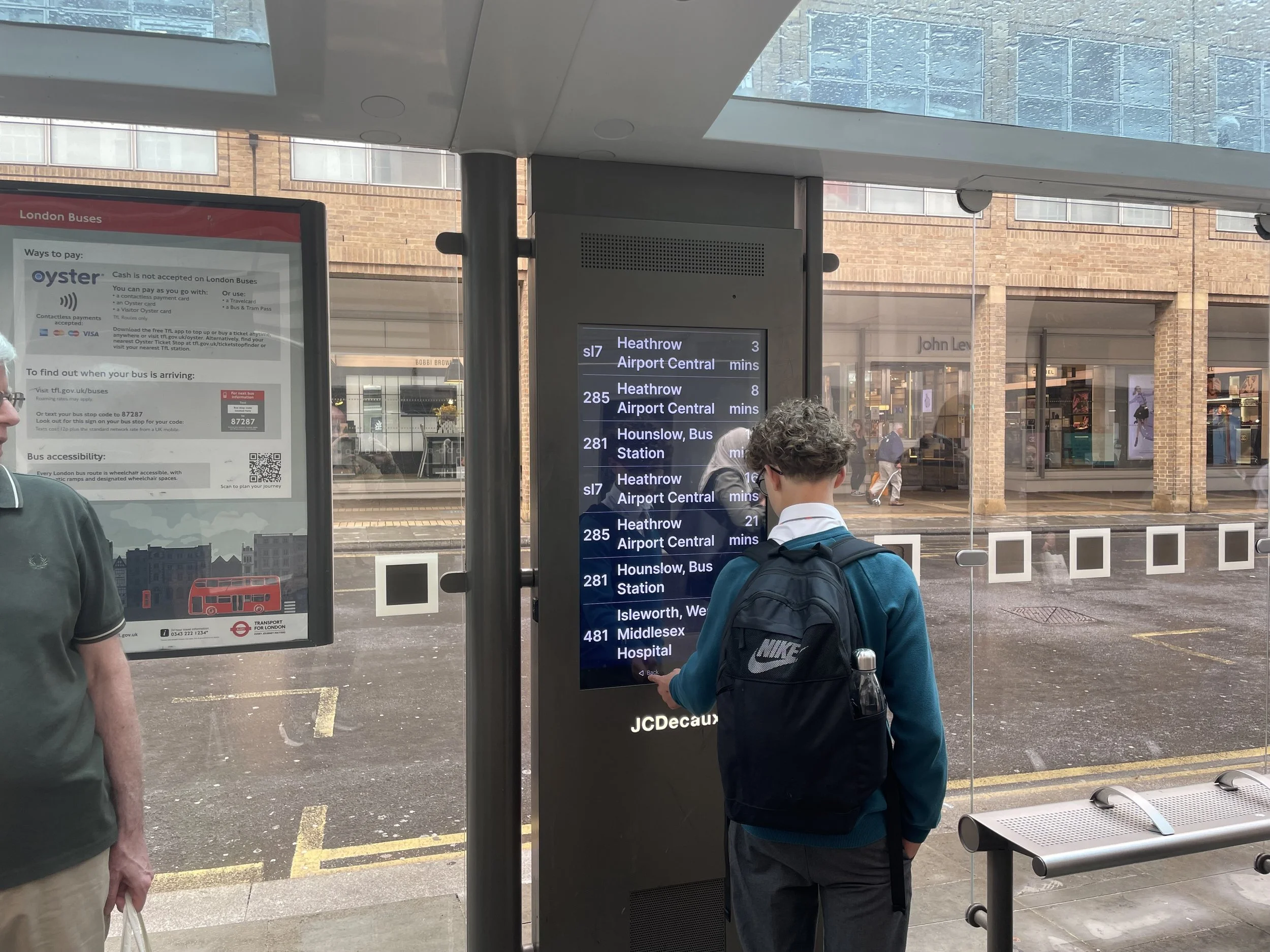 A PassageWay smart bus shelter RTPI digital sign at a bus shelter in London