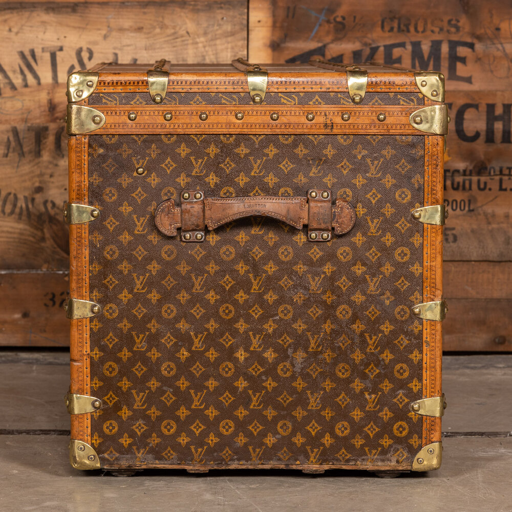 LOUIS VUITTON Wooden suitcase covered with monogrammed …