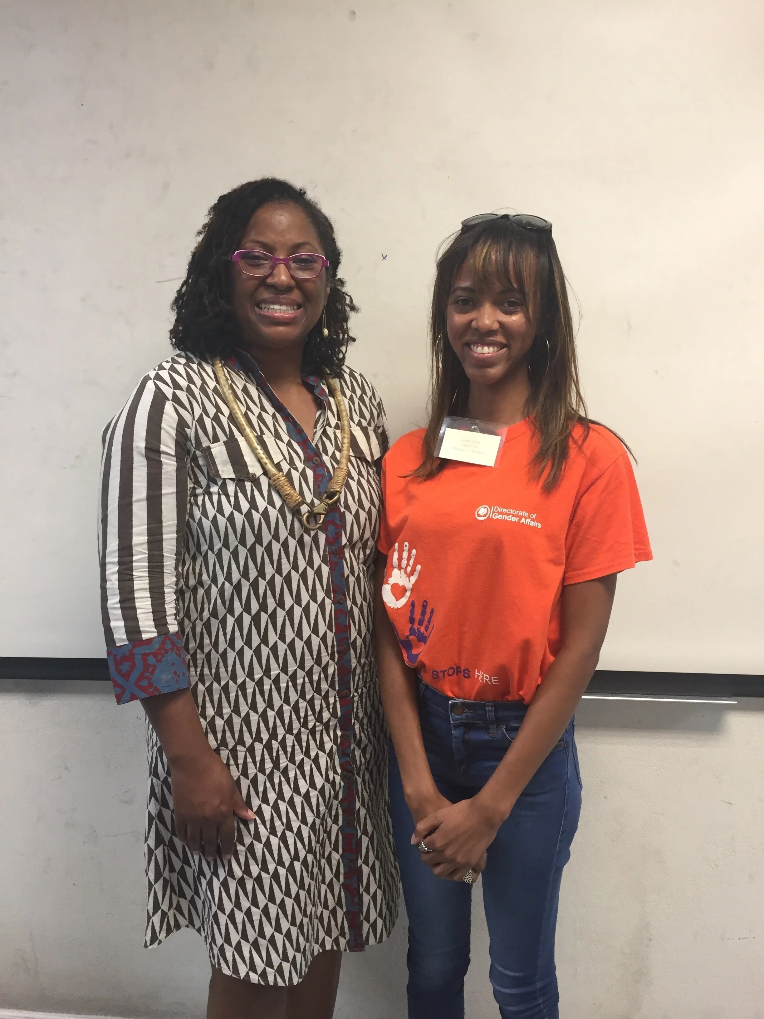 Sarah-Anne Gresham, co-founder of Intersect Antigua-Barbuda and research officer at the Directorate of Gender Affairs posing with Dr. Tracy Robinson at the Caribbean Institute for Gender and Development (CIGAD) in 2017 in Barbados.