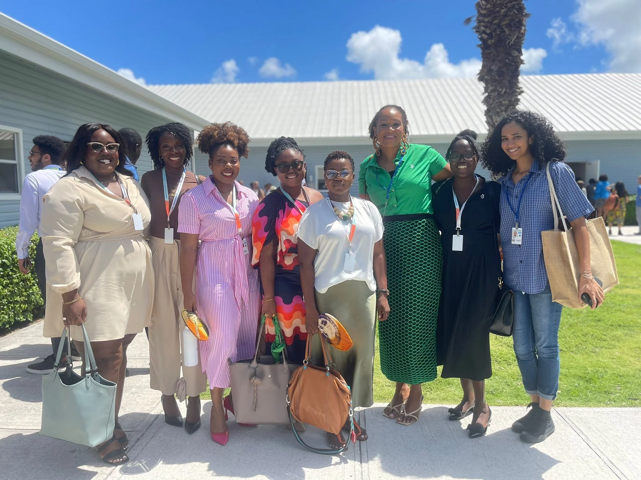 Intersect's resident artist, Lucia Murray (LEM) and former Intersect member Annetta Jackson,  with fellow attendees at the Small Island Developing States (SIDS) Conference in Antigua, 2024.