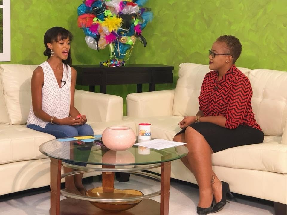 Sarah-Anne Gresham on live television in Antigua discussing the findings of her study on promo girls/brand ambassadors.