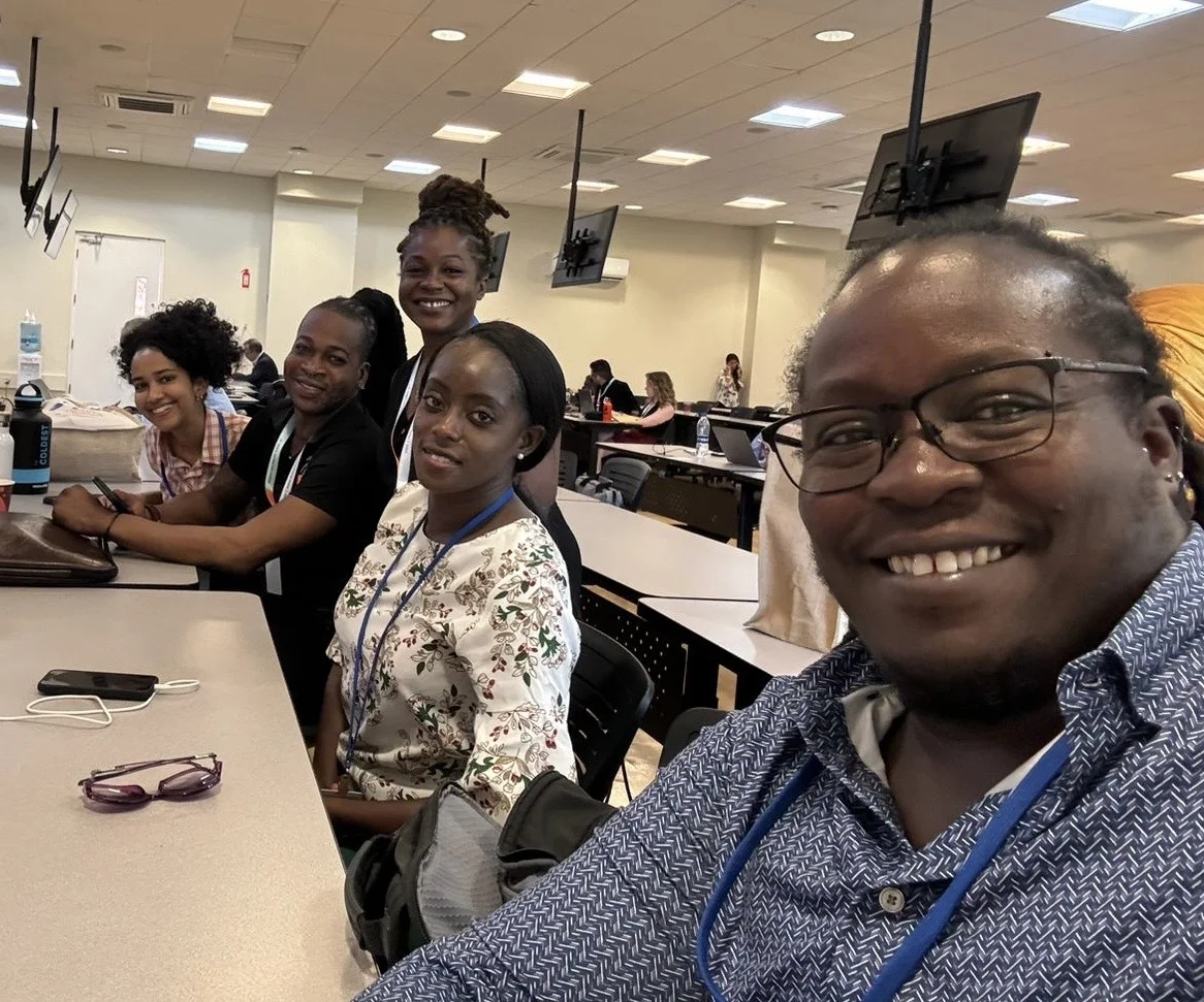 Intersect's resident artist, Lucia Murray (LEM) with fellow attendees Kenita Placide (ECADE), Orden David, and Leah Thompson (Outright International) at the Small Island Developing States (SIDS) Conference in Antigua, 2024.