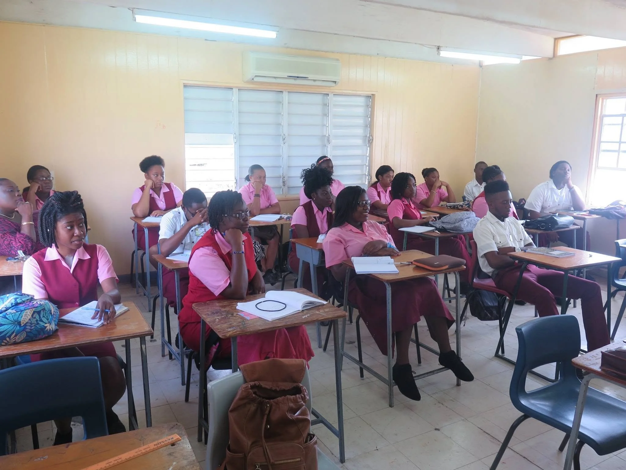 Students at the Antigua State College listening to a presentation by Nneka Nicholas and Sarah-Anne Gresham, co-founders of Intersect Antigua-Barbuda.