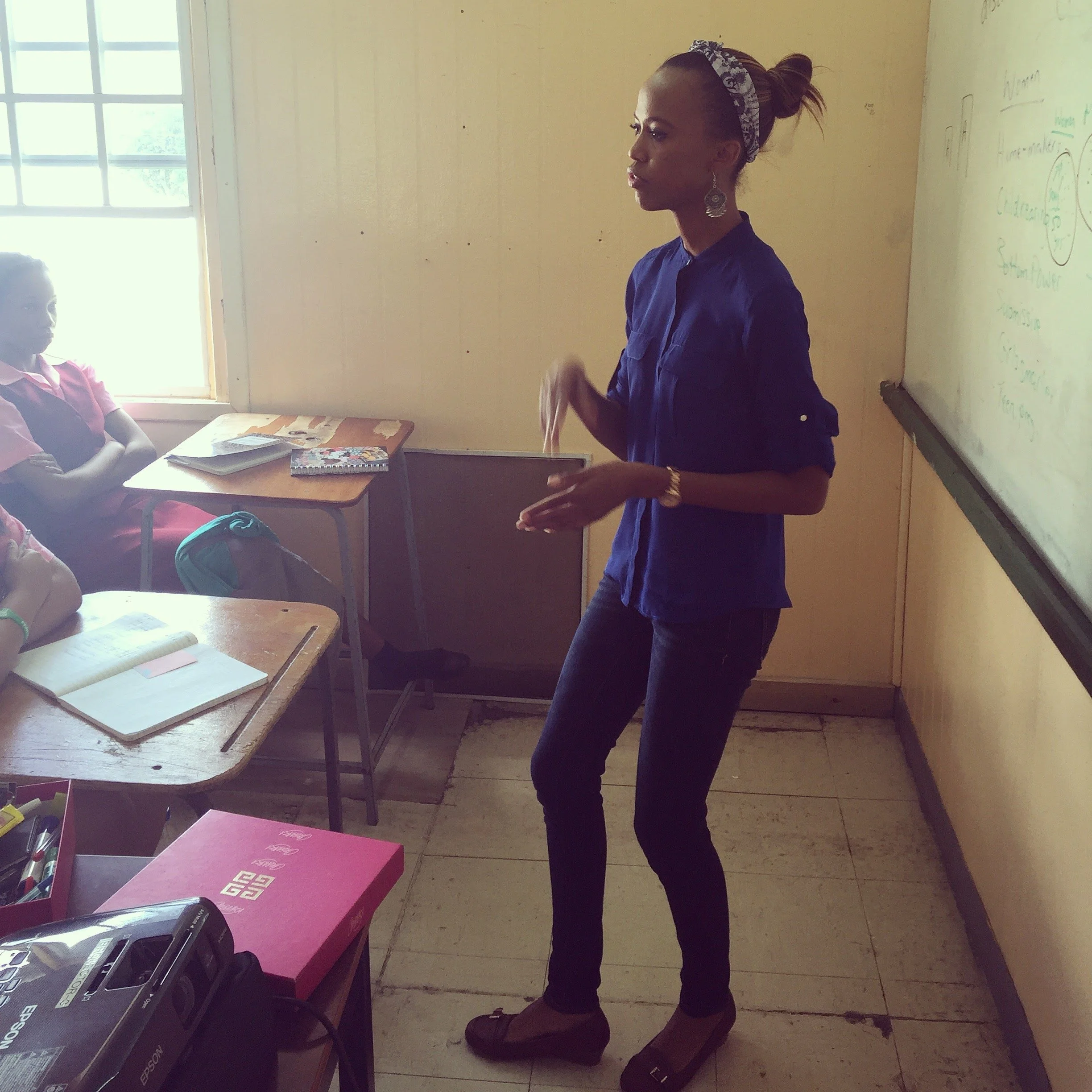 Intersect's co-founder, Sarah-Anne Gresham, discussing feminism with students at the Antigua State College in 2016.