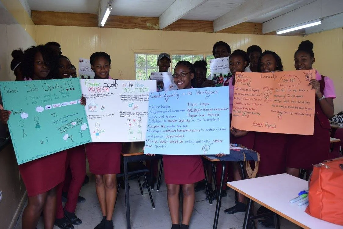 Students' presentation posters after a lecture delivered by Sarah-Anne Gresham in 2017 at the Antigua State College.