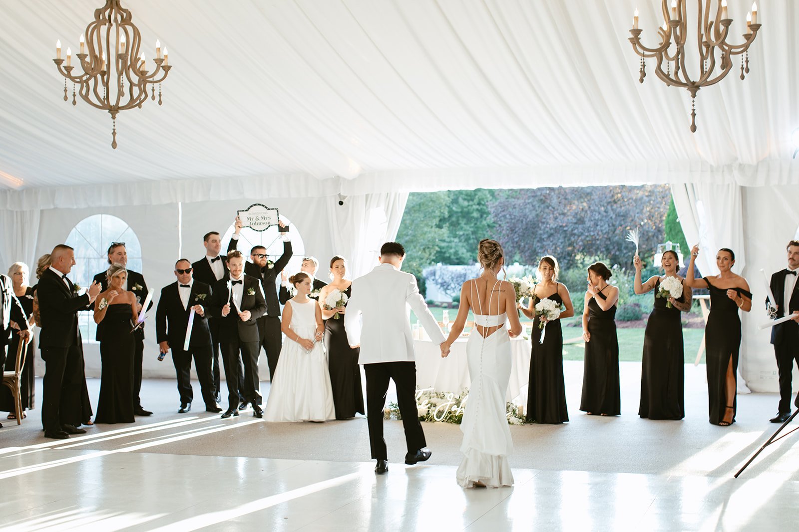 A tented Massachusetts wedding reception with black and white