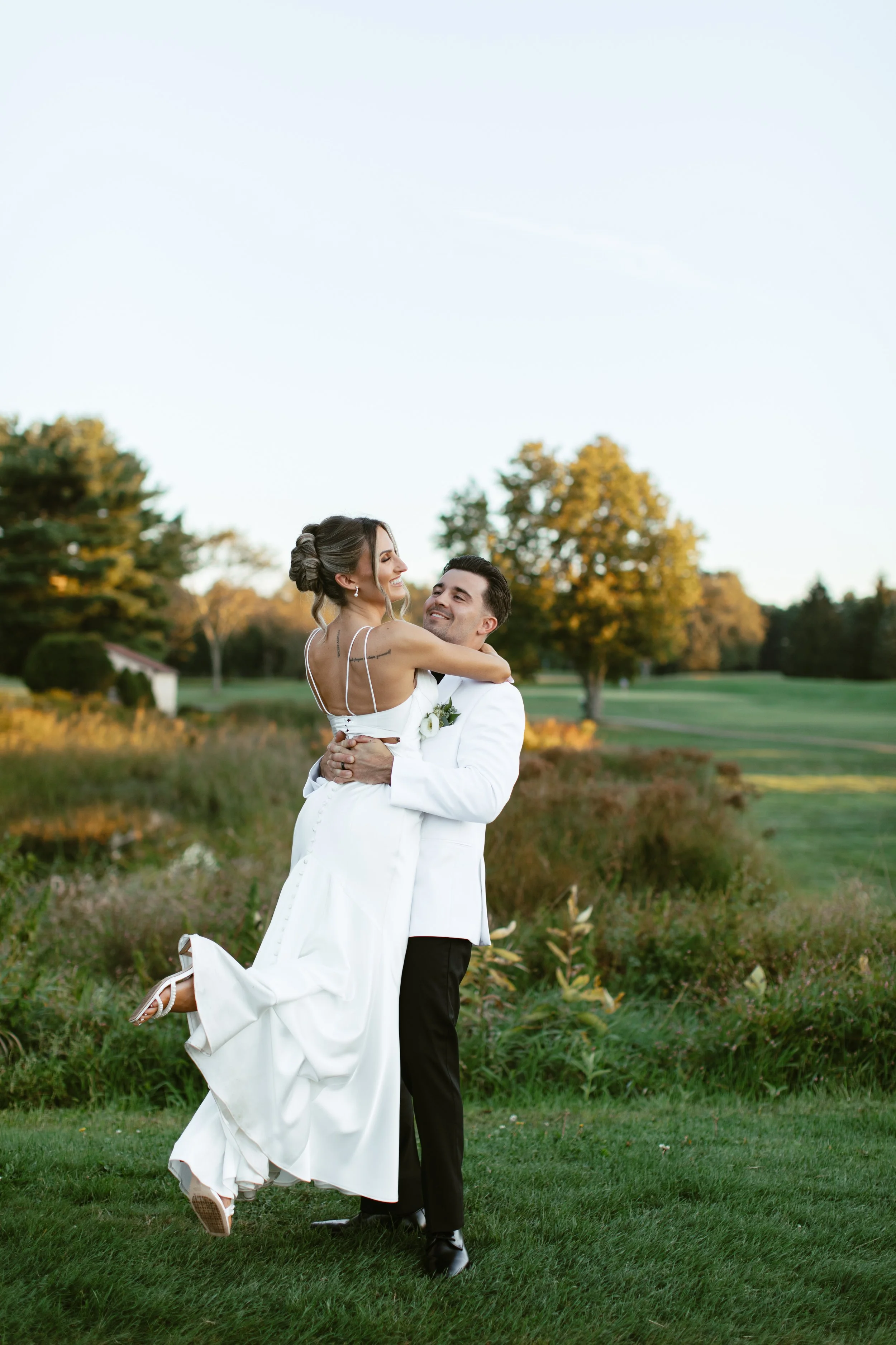 Wedding couple portraits in the greens during sunset at the Villa