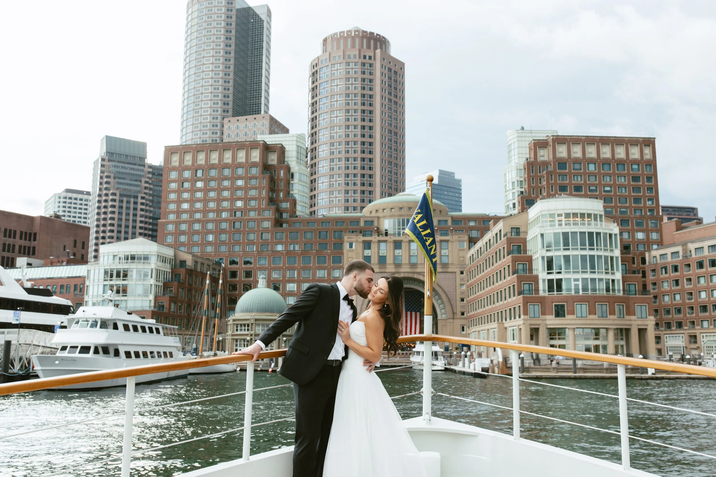 Couple on a boat with Boston skyline background