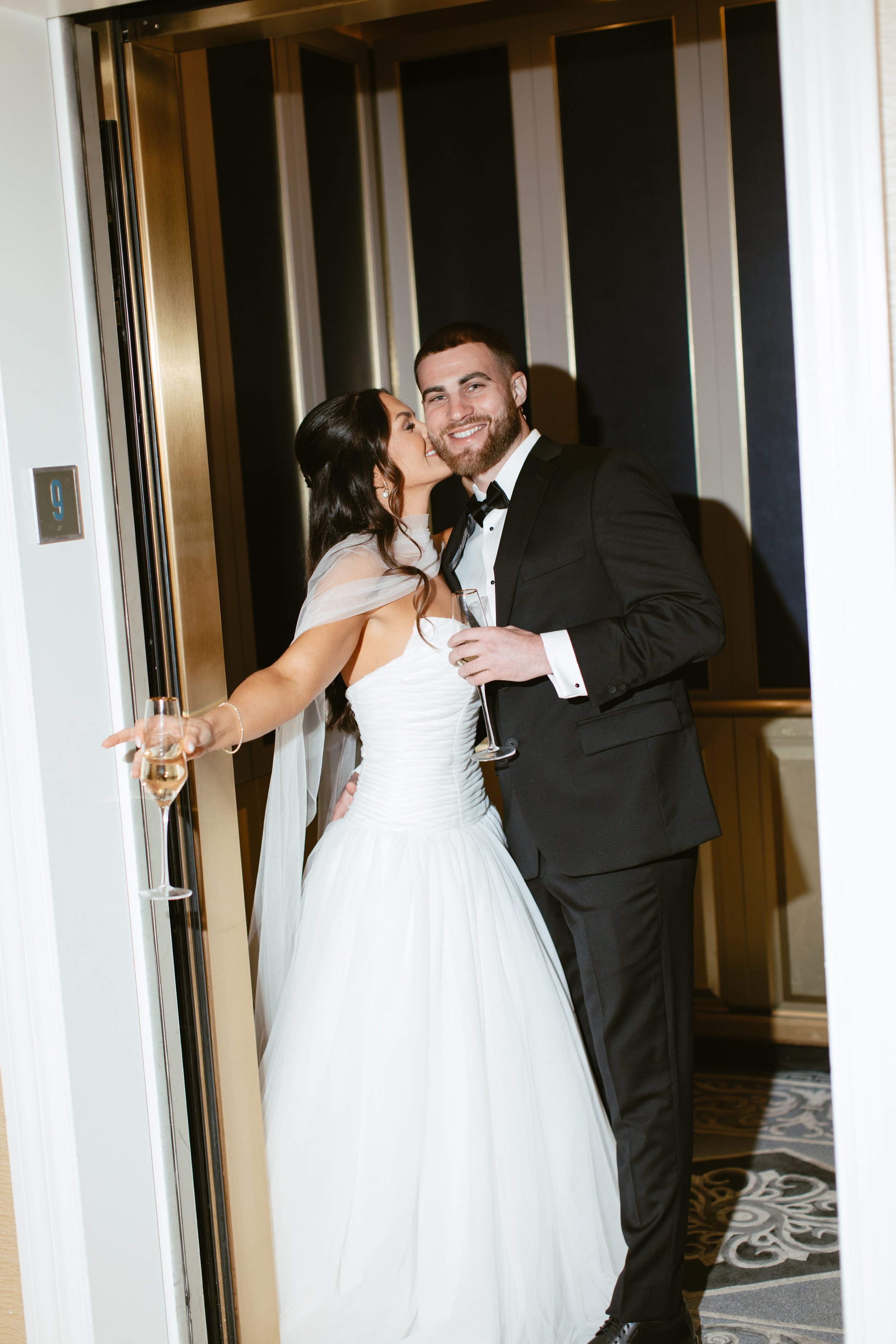 Bride and groom elevator in Boston hotel