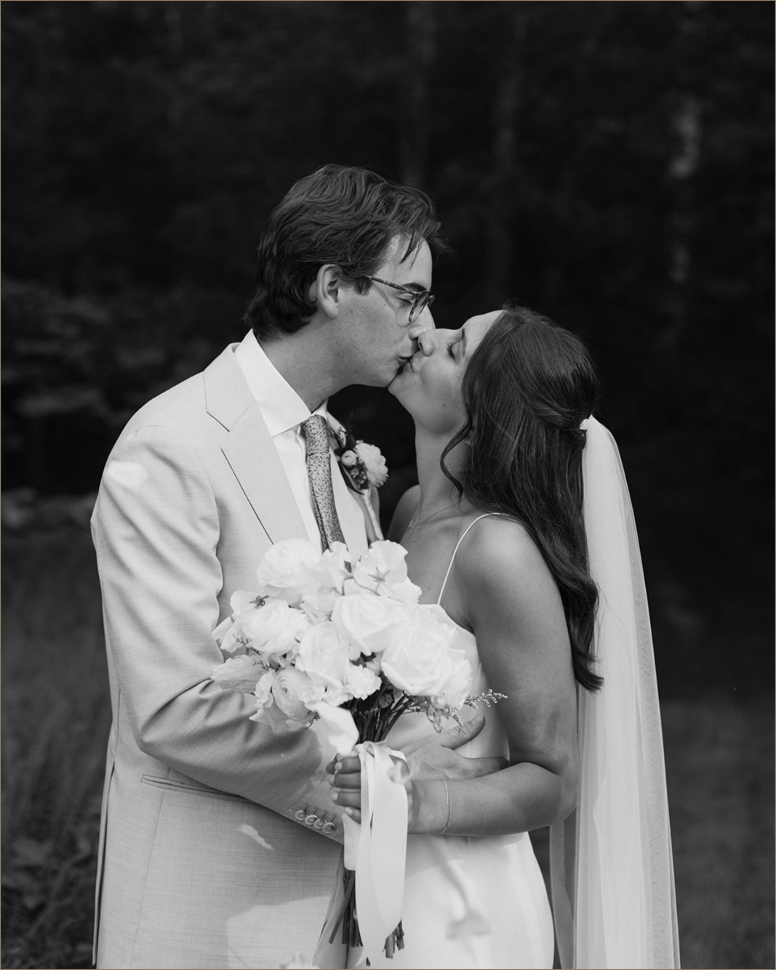 East coast bride and groom kissing