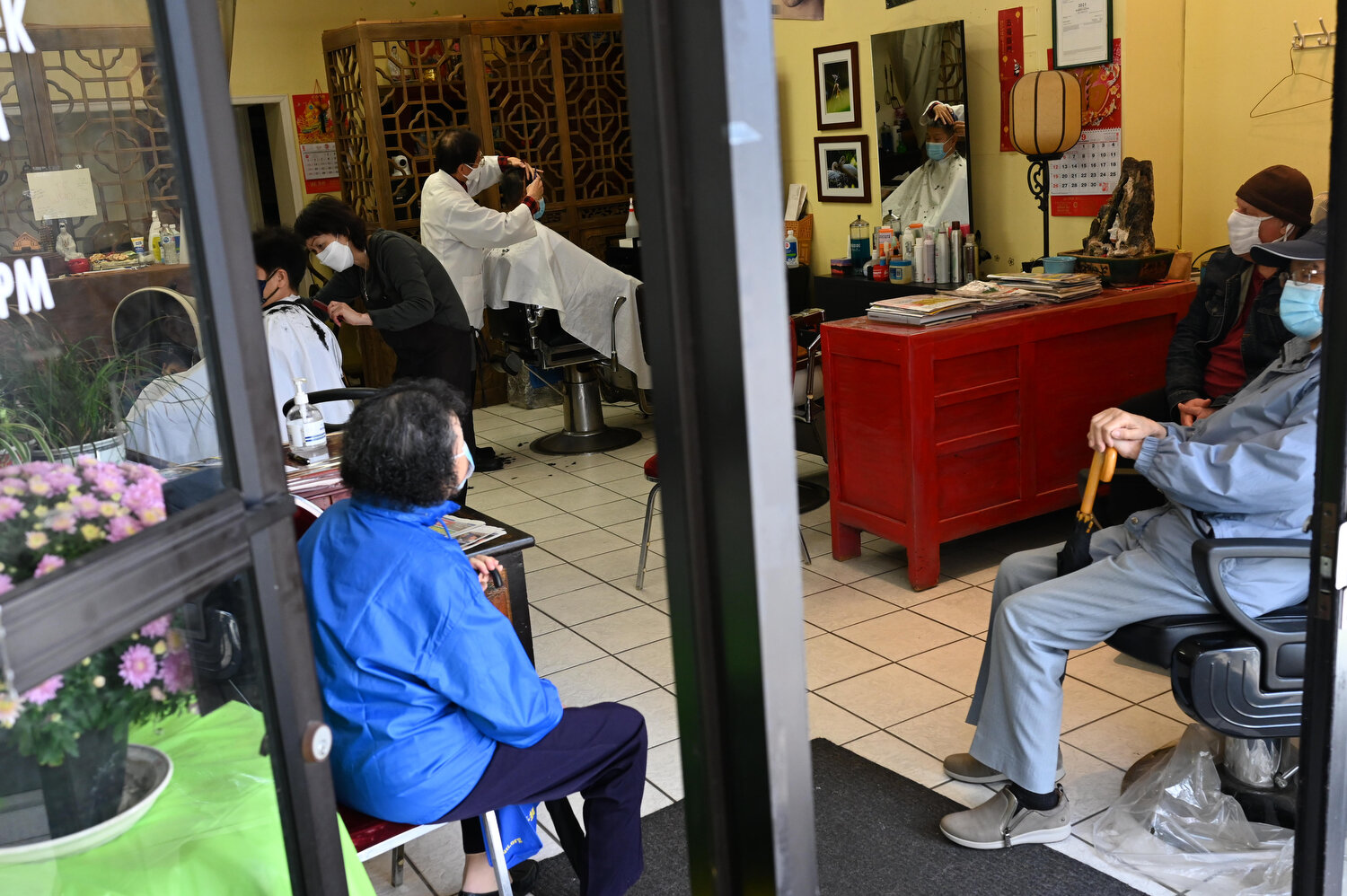  After a quiet morning, an afternoon rush occurs and all the chairs get filled with customers. Wong says, though unusual now, this is typical of their day-to-day prior to the pandemic. 