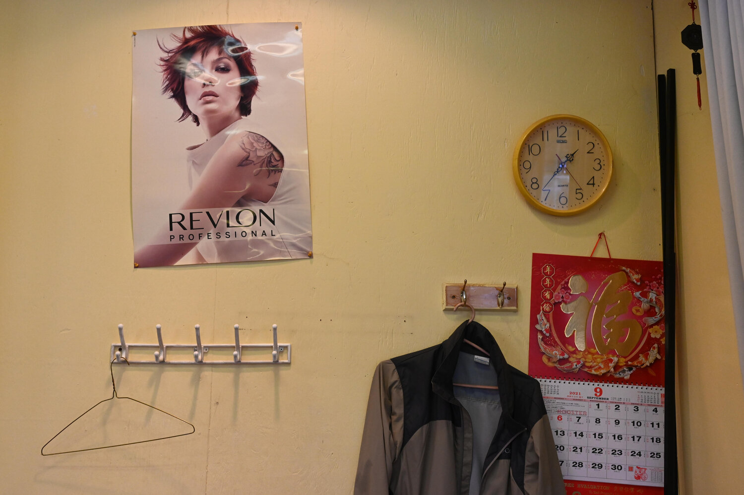 A common sight on Wong’s side of the salon, where the coat rack sits empty, and time passes slowly. “Since Covid-19 started, my senior customers don’t venture out anymore. Their children want them home to keep them safe. But when they do come, I wan
