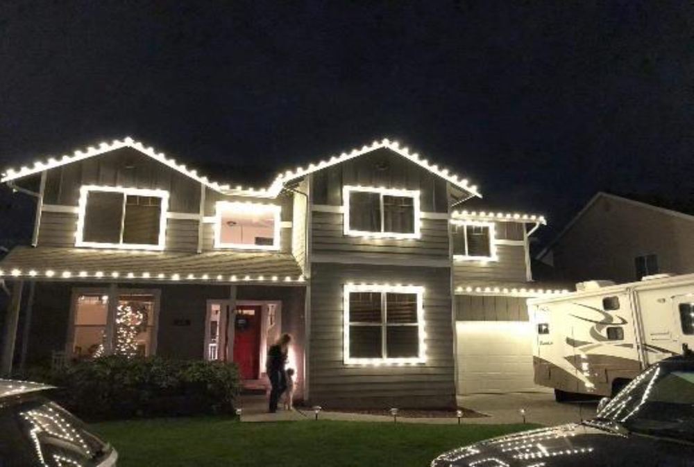 Windows, garage trim, and fascia boards wrapped with lights