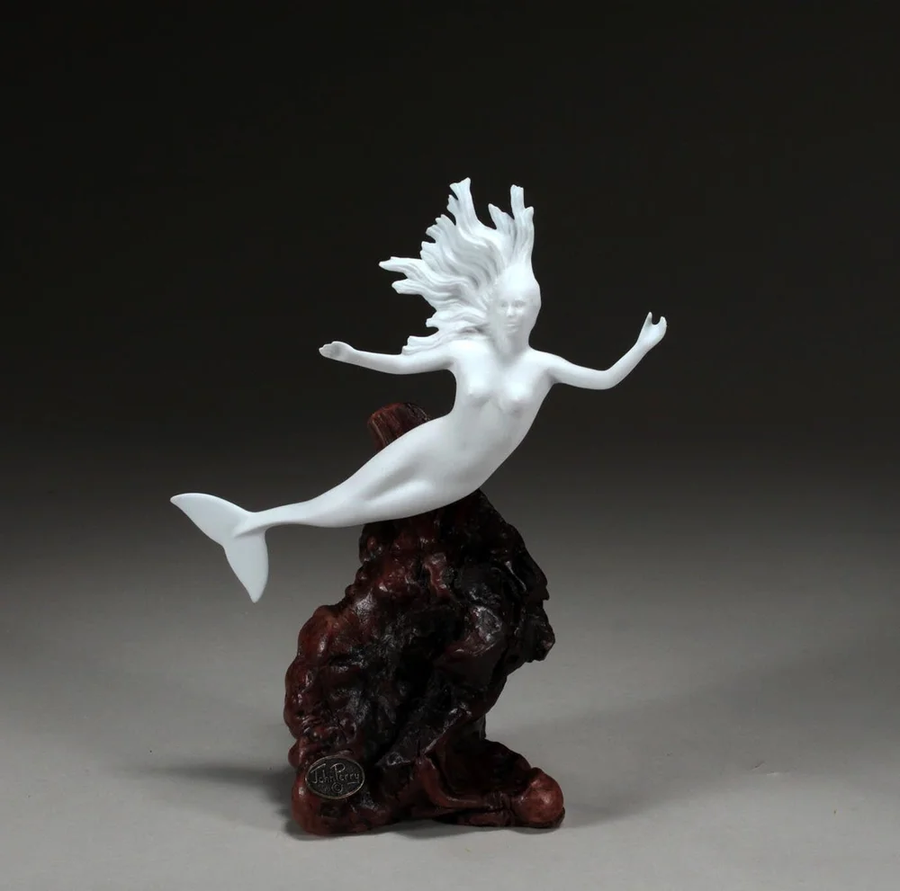 Mermaid by John Perry 9 inch tall Pellucida sculpture on burlwood
