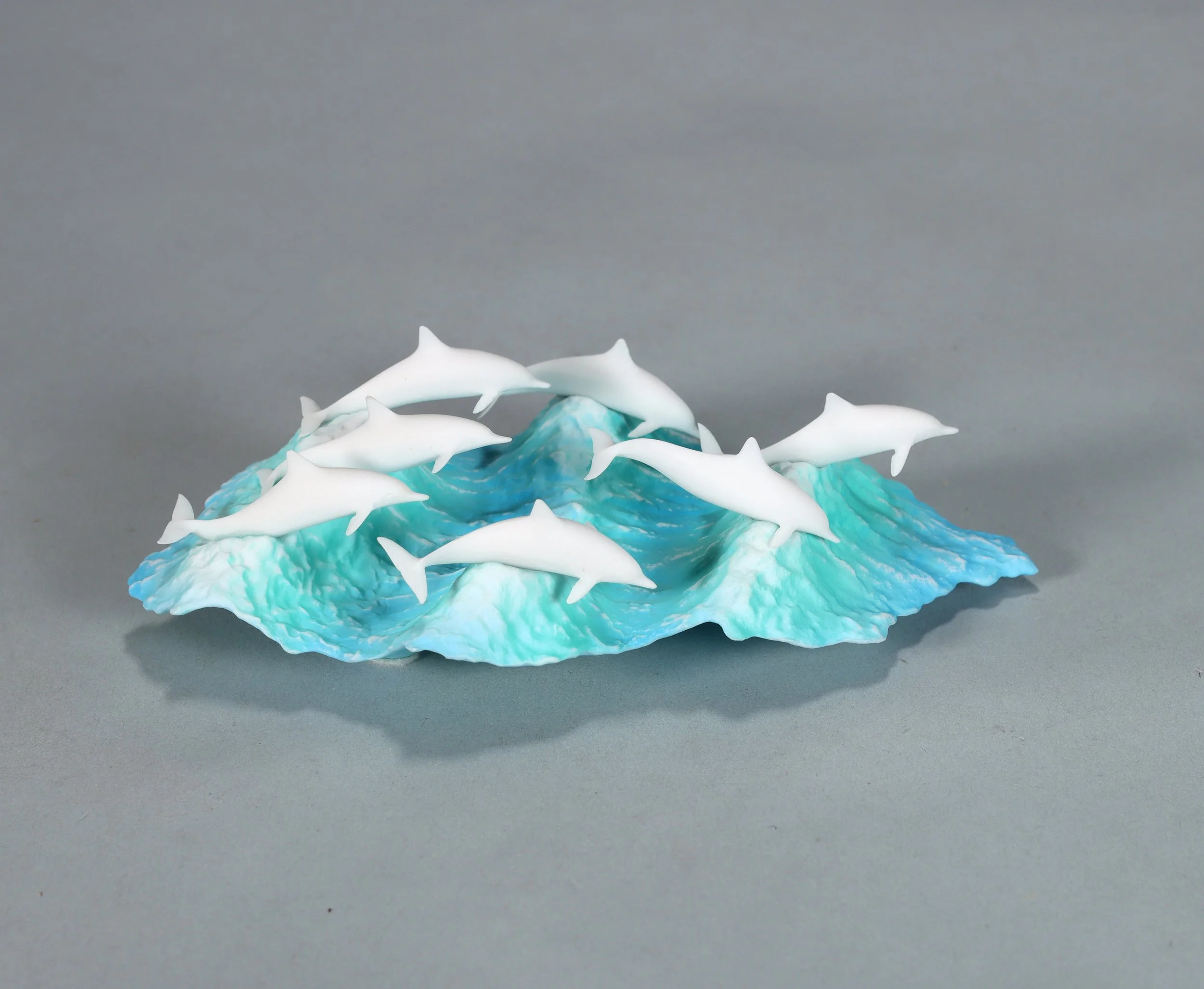 School of Dolphins Sculpture (7 Dolphins) Pellucida 8in Long on Burlwood